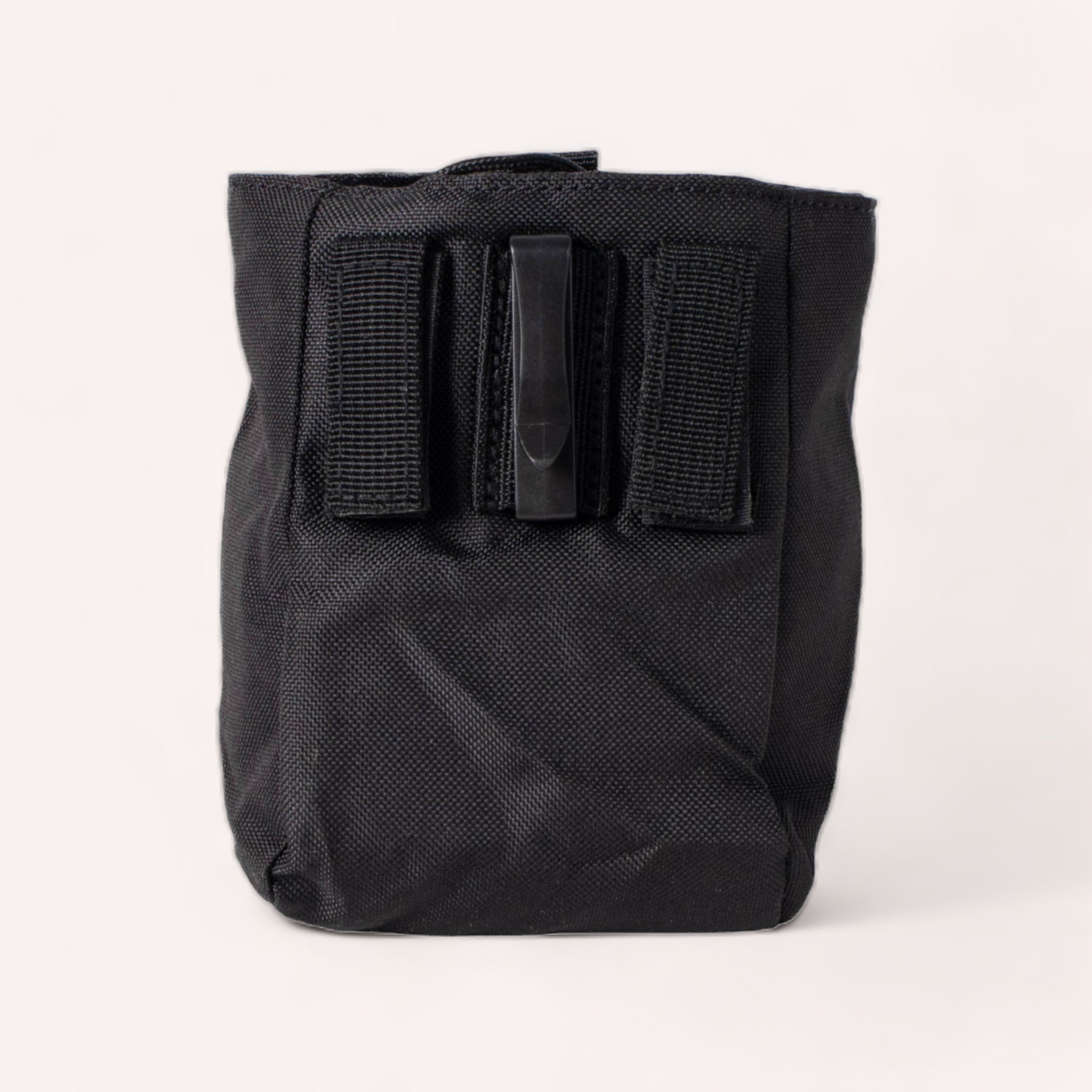 A Black Treat Pouch by Wolves of Wellington with a textured surface and a velcro flap closure on a white background, ideal for positive reinforcement training.
