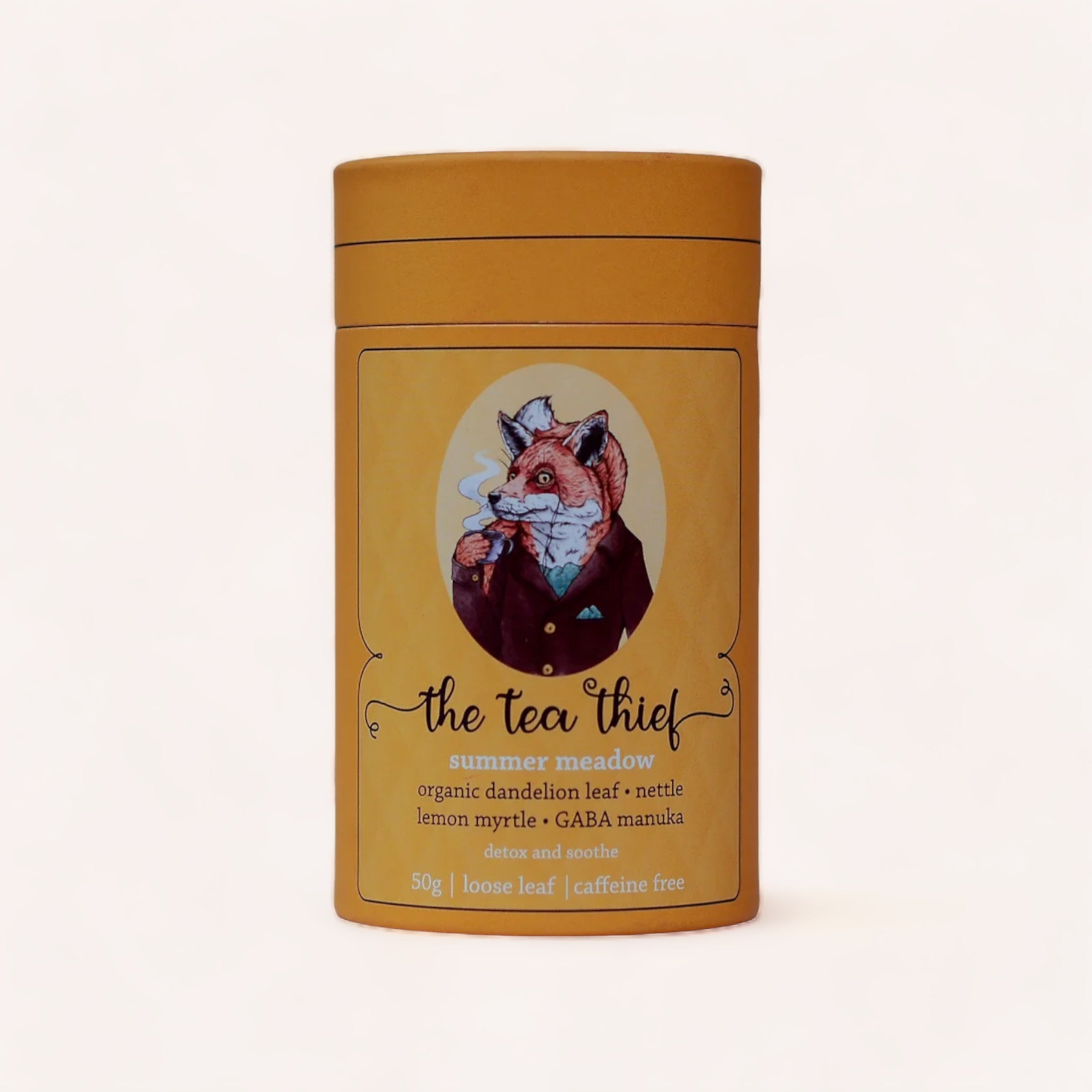 A whimsical tea container labeled "Summer Meadow 50g by The Tea Thief" featuring an illustrated fox wearing a collared shirt and blazer. The tea is described as "energy-boosting summer meadow" with ingredients.