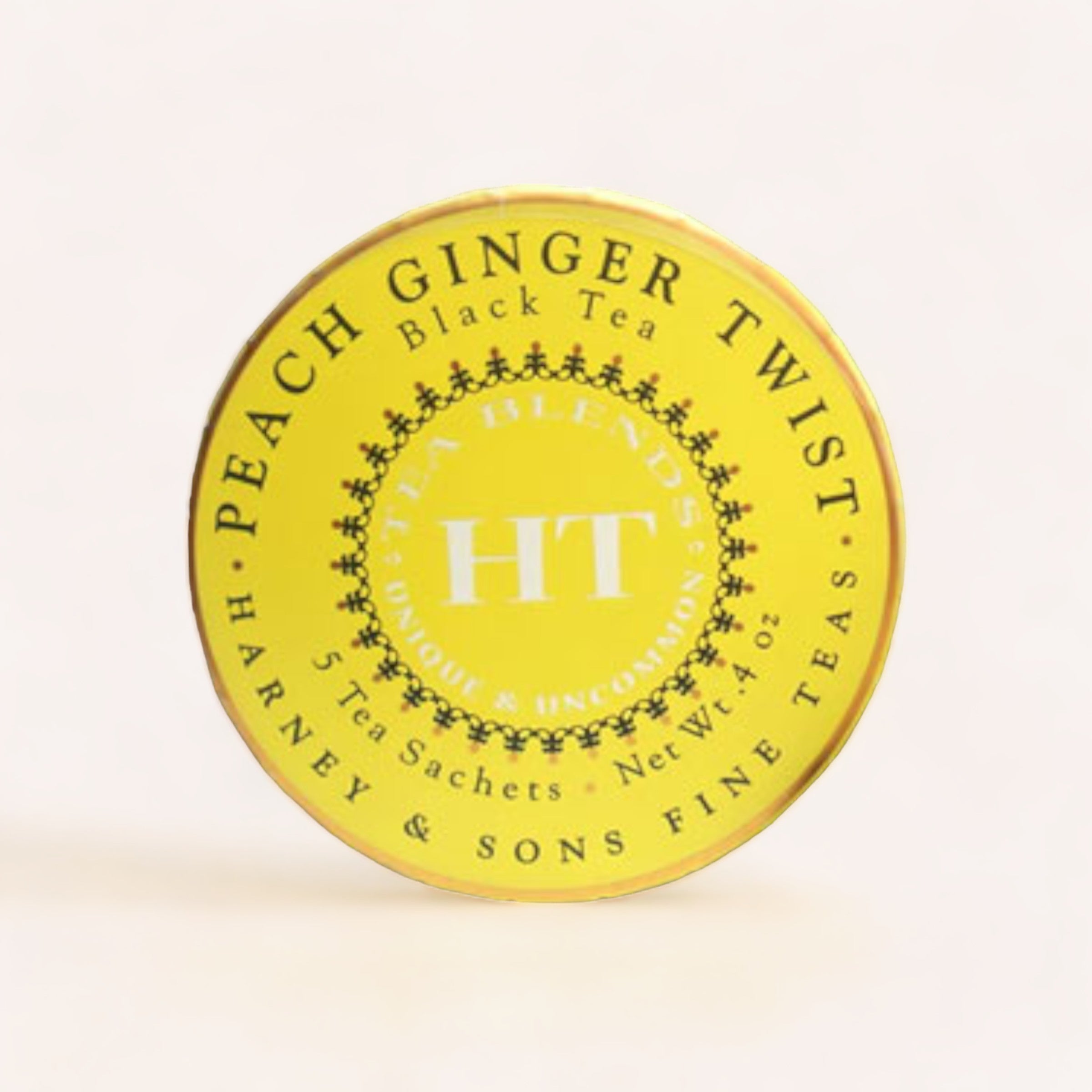 Round yellow tin labeled "Peach Ginger Twist Tea Tagalong by Harney & Sons" containing five pyramid silken sachets.