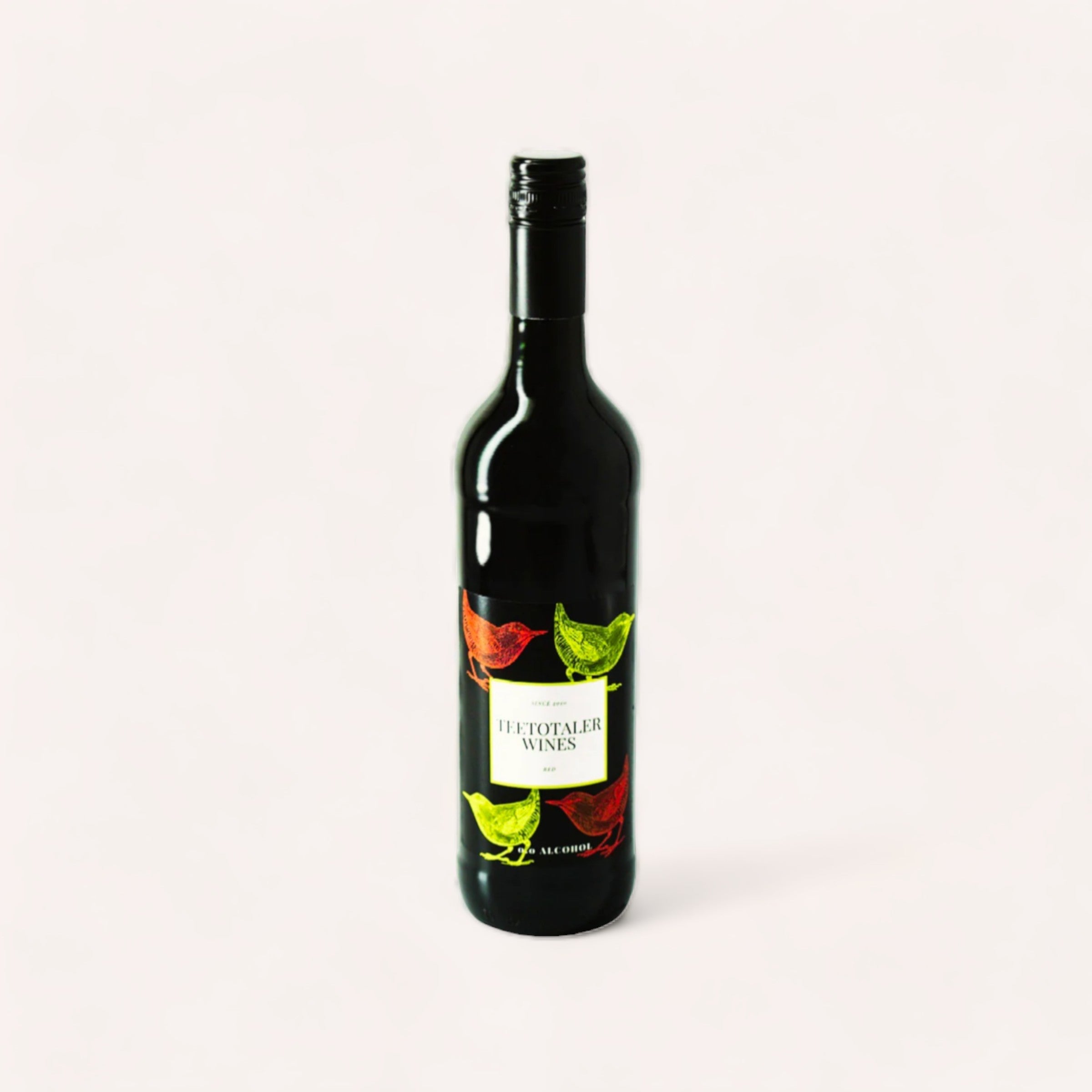 A bottle of Red Wine by Teetotaler, zero alcohol wine with a vibrant label featuring colorful leaves against a plain background.