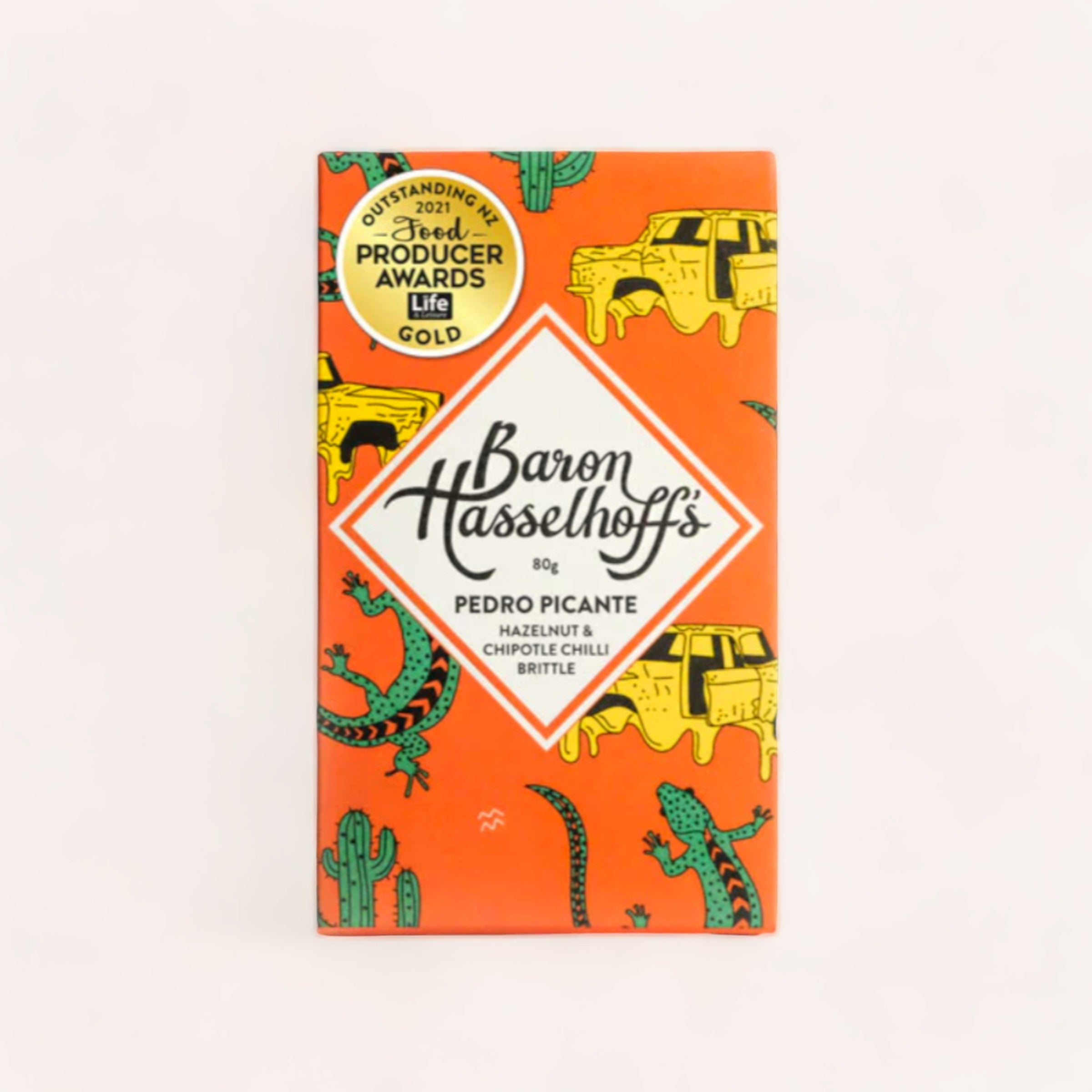 A colorful chocolate bar wrapper with vibrant illustrations of cacti and a unique mix of flavors: Pedro Picante Peanut Brittle, hazelnut brittle & chipotle chilli brittle. The brand is "Baron Hasselhoff's".