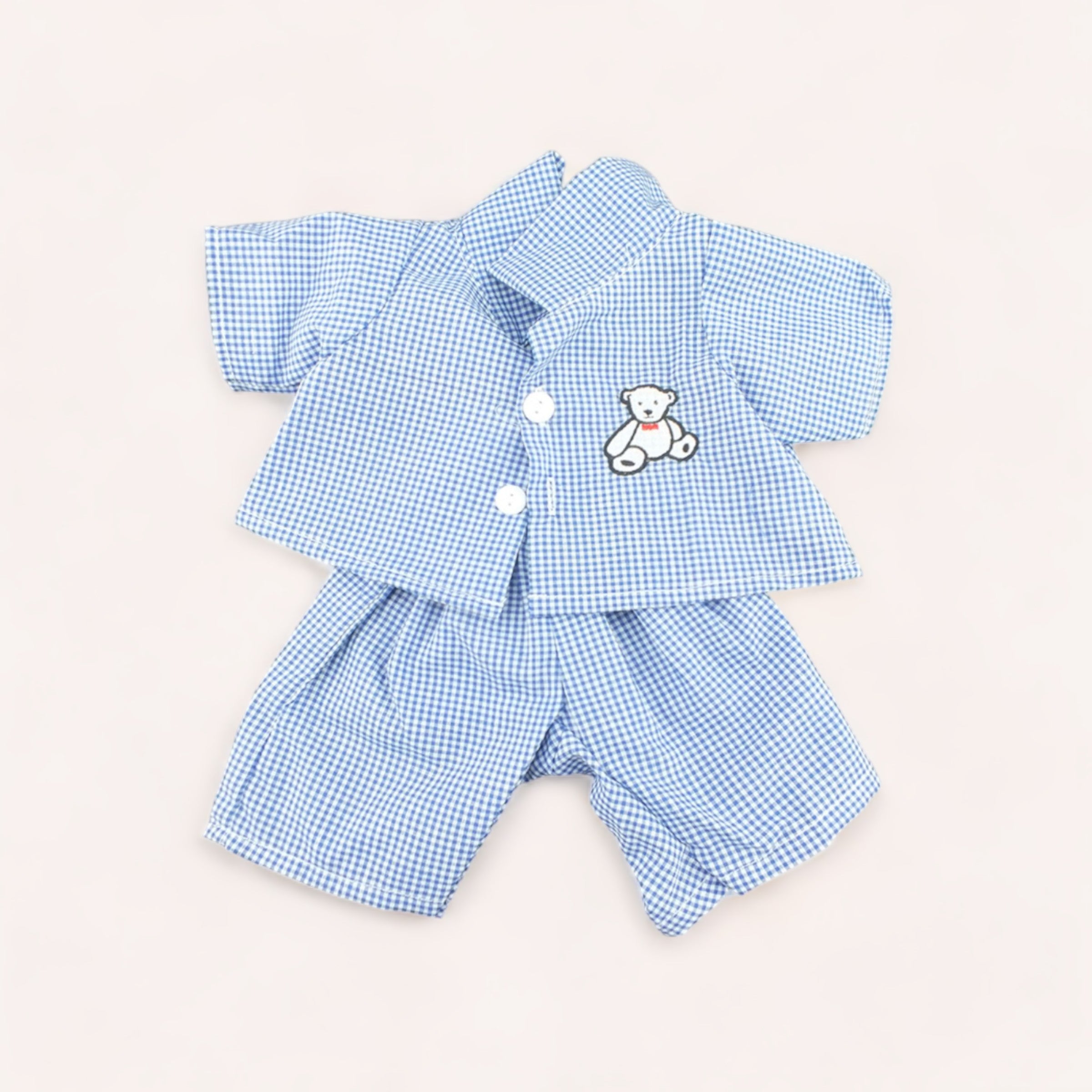 Baby's Bear PJ's Outfit by The Teddy Factory, featuring a white and checkered design with a teddy bear patch on a white background, perfect for the bedtime routine.