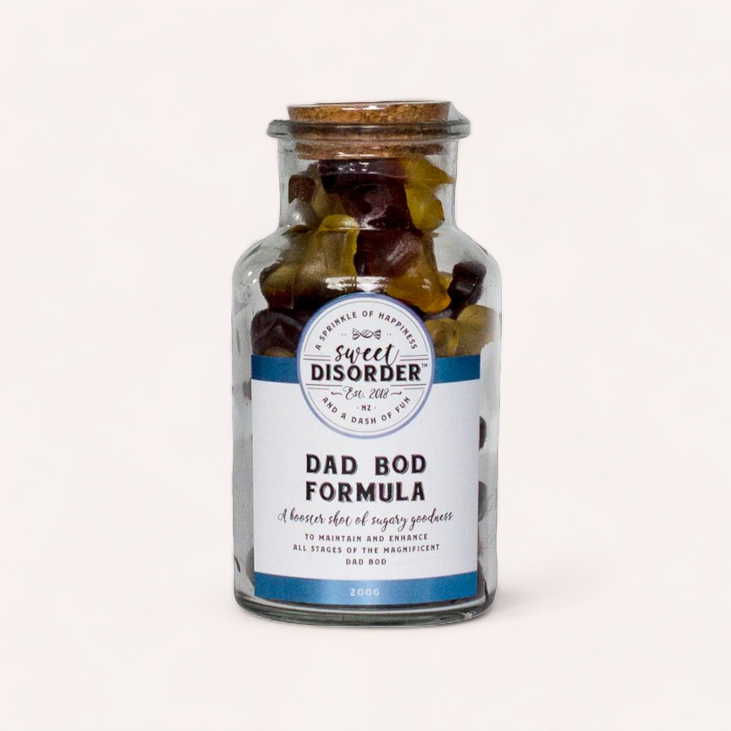 A jar of "Dad Bod Formula" cola flavoured gummies by Sweet Disorder with a humorous label, presented as an amusing novelty item.