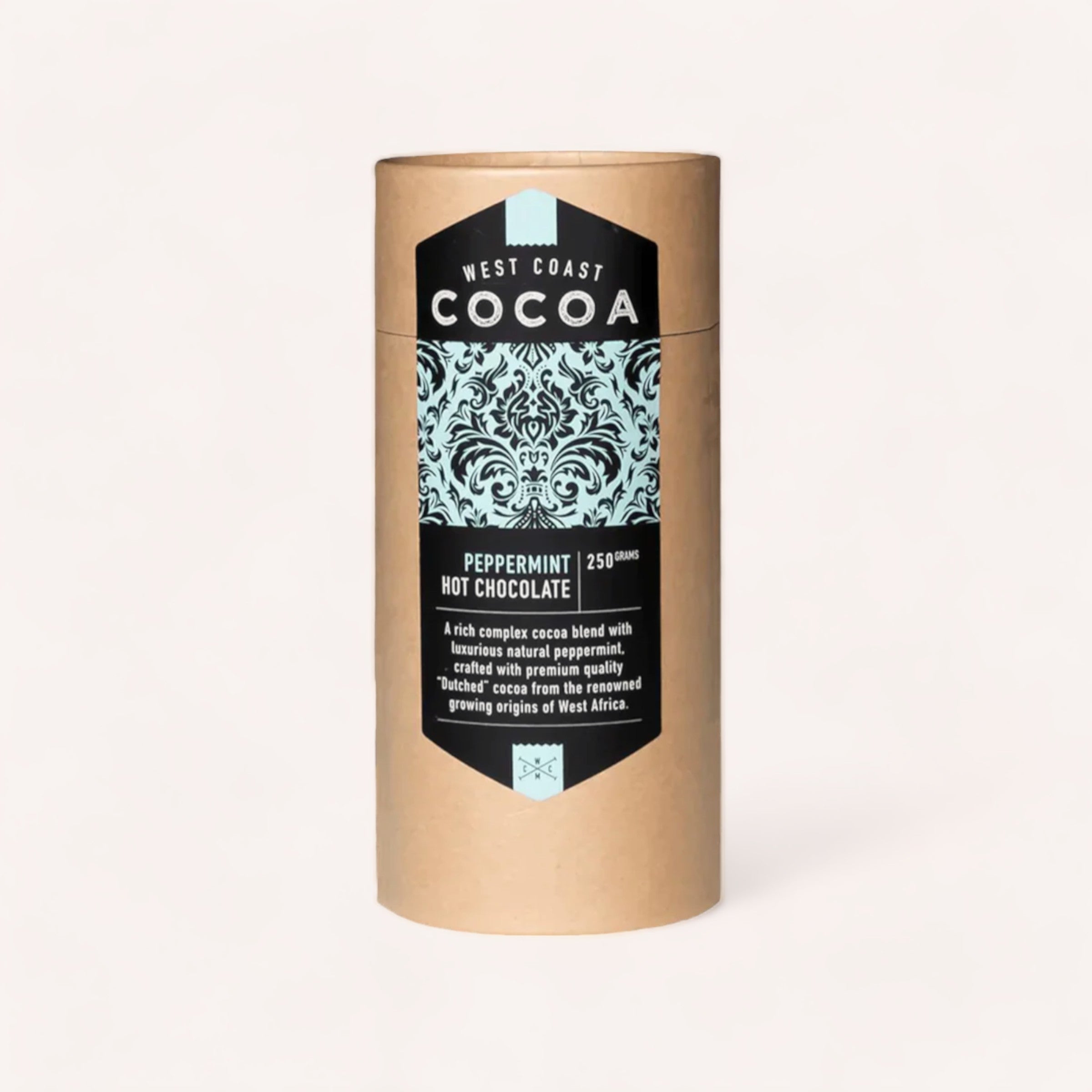 A cylindrical container of Peppermint Hot Chocolate 250g by West Coast Cocoa, featuring an intricate black and white label design and text that mentions its rich Dutched cocoa blend with a twist of peppermint, using.