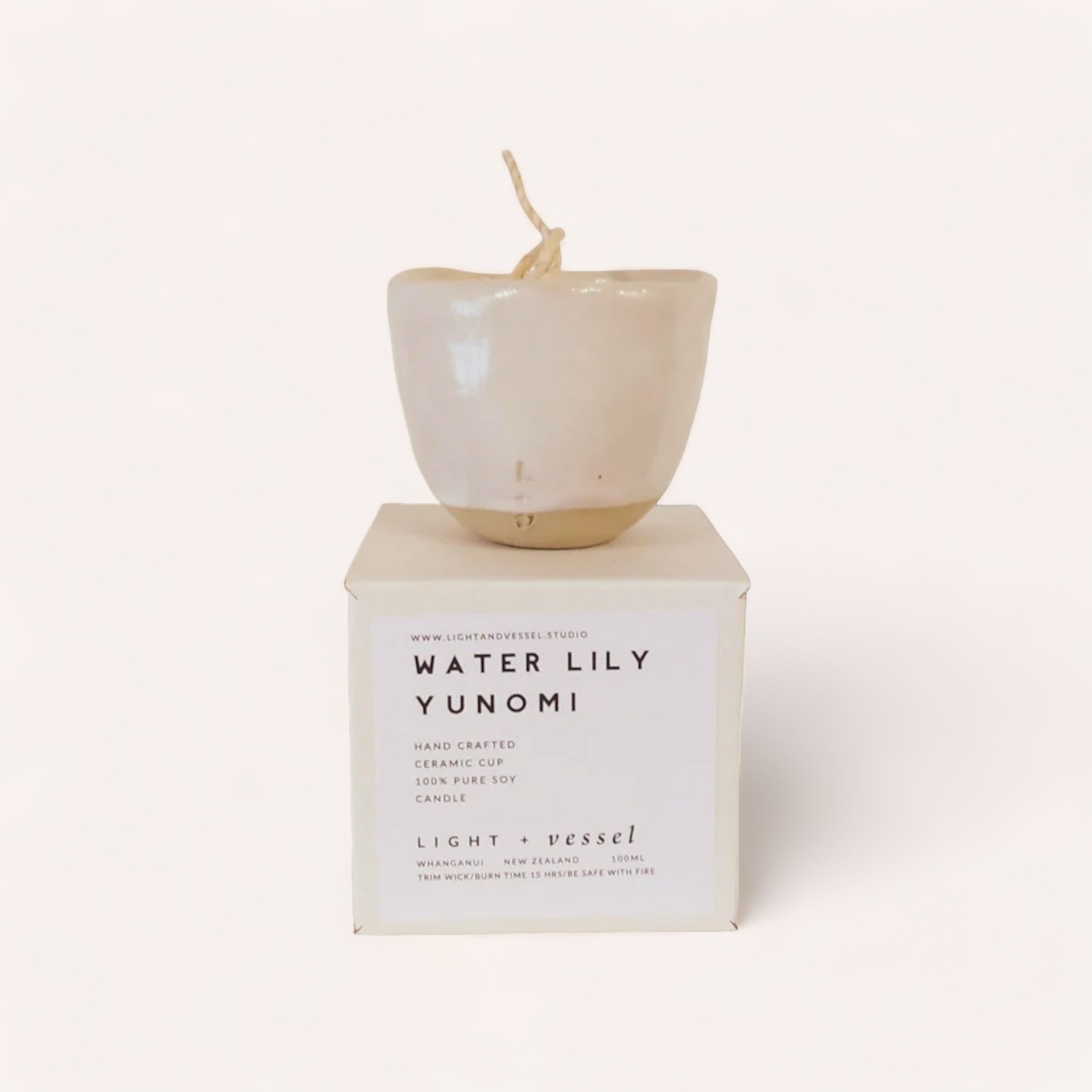 A serene, handcrafted Water Lily Candle by Light + Vessel styled as a Japanese tea cup, with the delicate fragrance of water lily, presented on a minimalist white background.