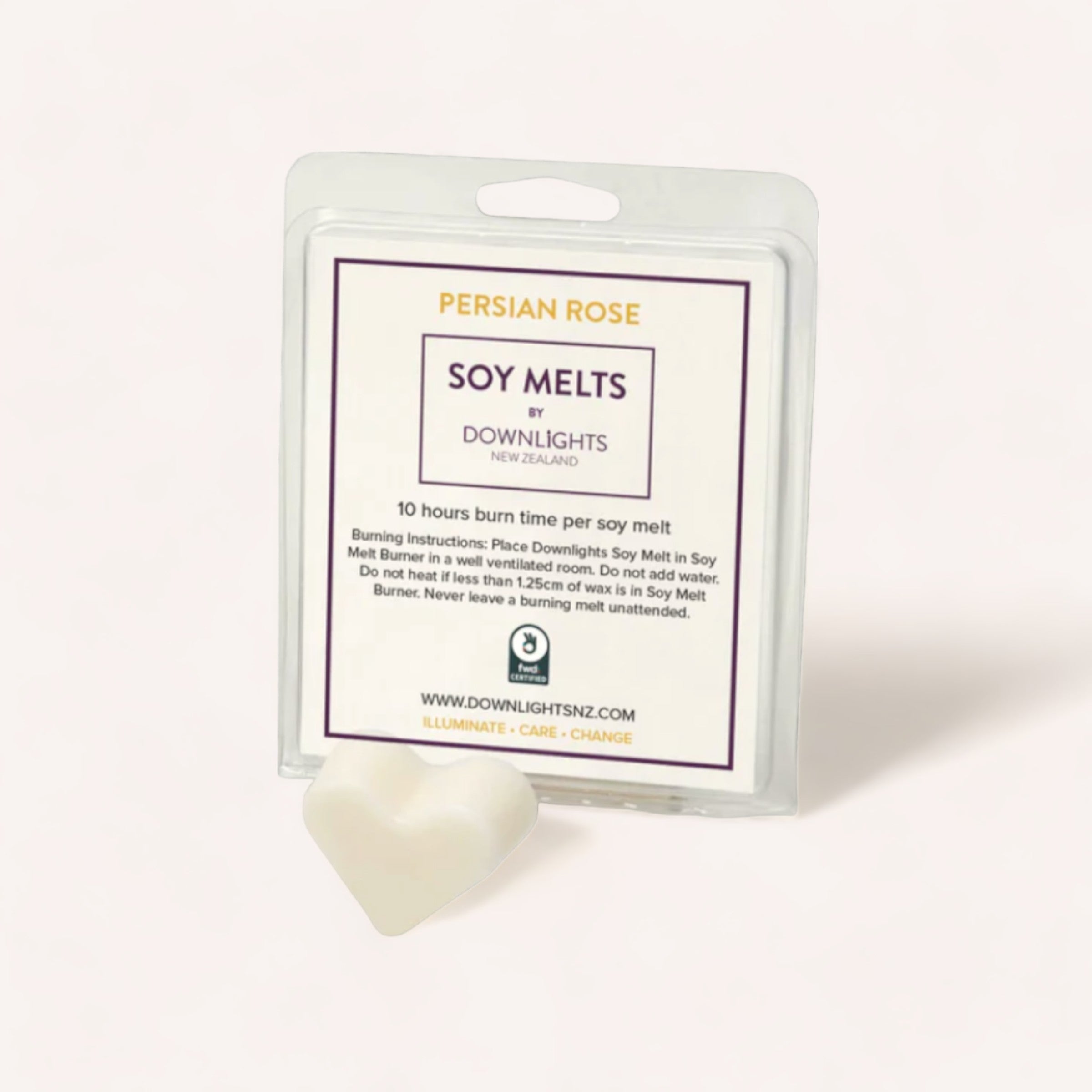 A package of Persian Rose Heart Soy Melts by Downlights, a New Zealand brand, with a single heart-shaped melt placed in front of it.