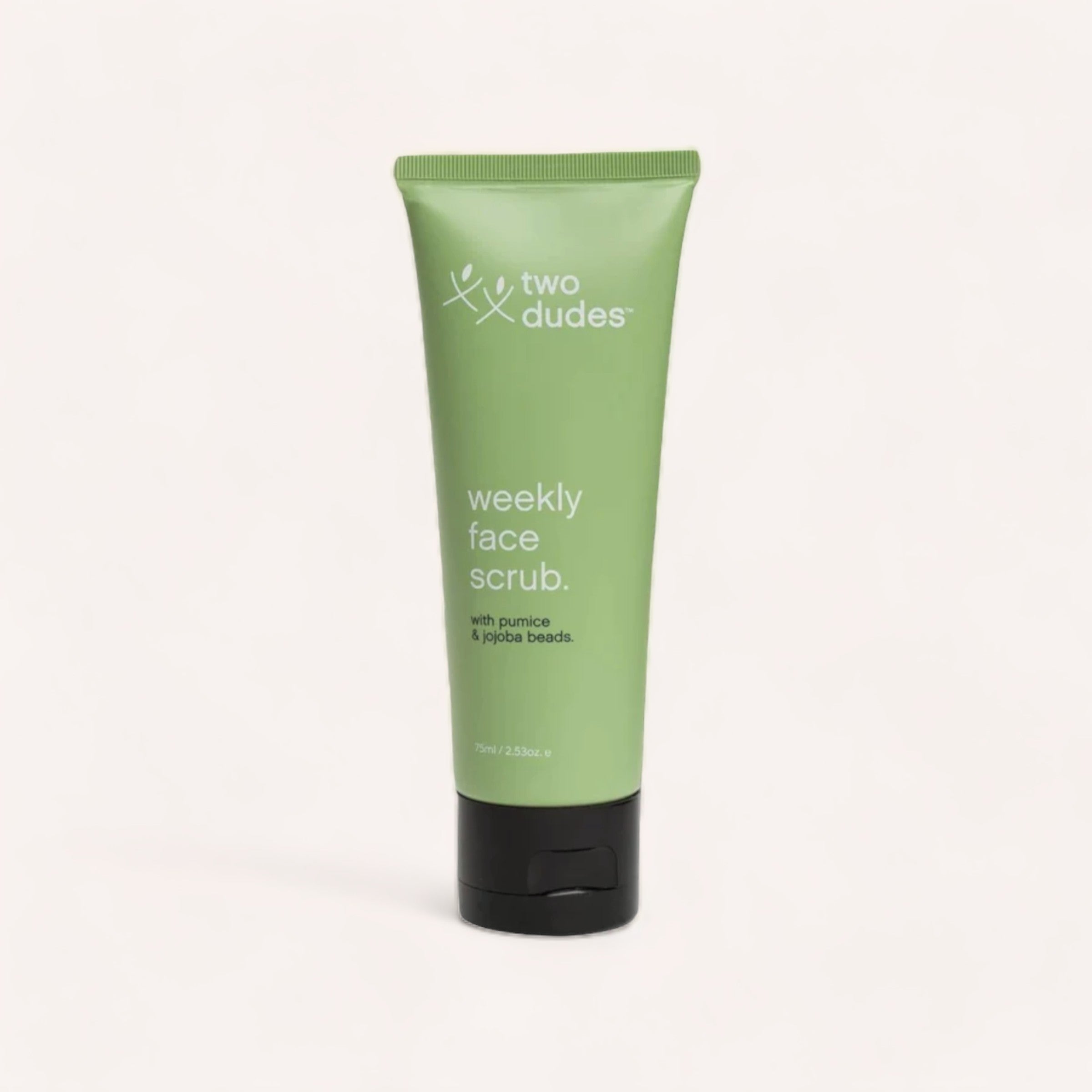 A tube of "Weekly Face Scrub by Two Dudes" against a clean, white background.
