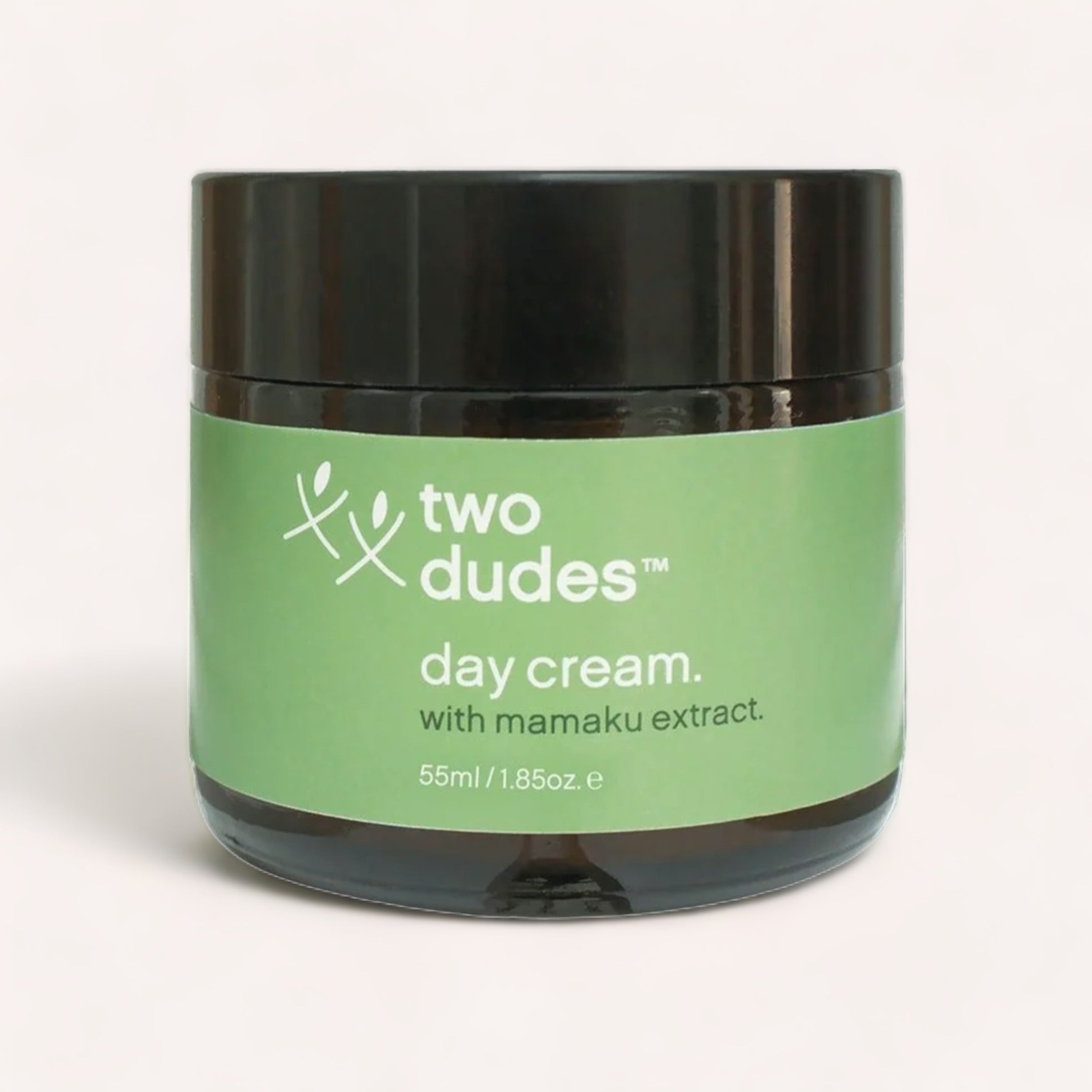 A container of "Two Dudes™ Day Cream by Two Dudes with mamaku extract for skin protection, 55ml / 1.85oz." against a plain background.