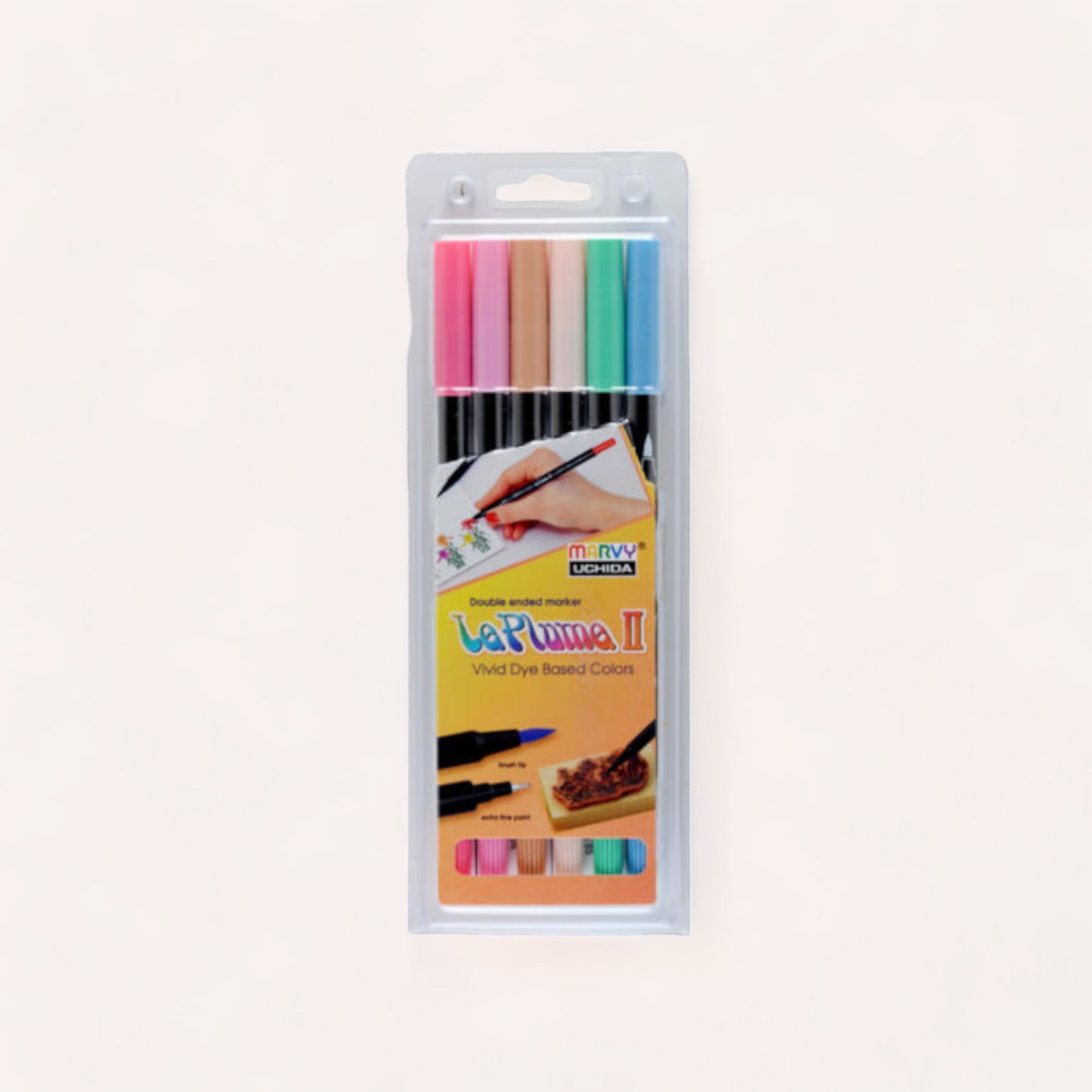 A pack of colorful, Marvy Le Plume II Dual Tip Marker Set - Pastel displayed on a light background, ideal for creative fabric dye projects.