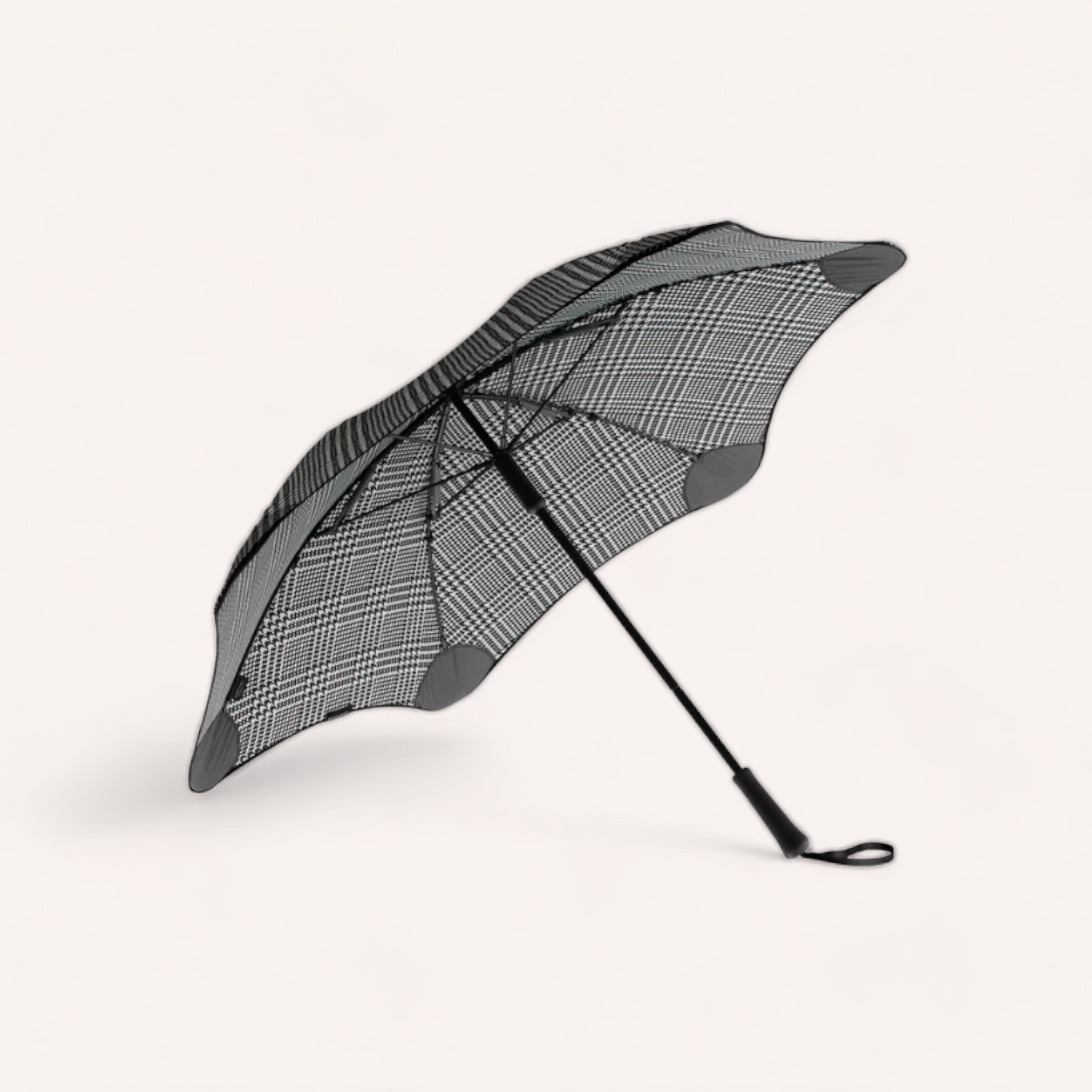 A compact, BLUNT Metro Umbrella Houndstooth - Limited Edition open against a white background.