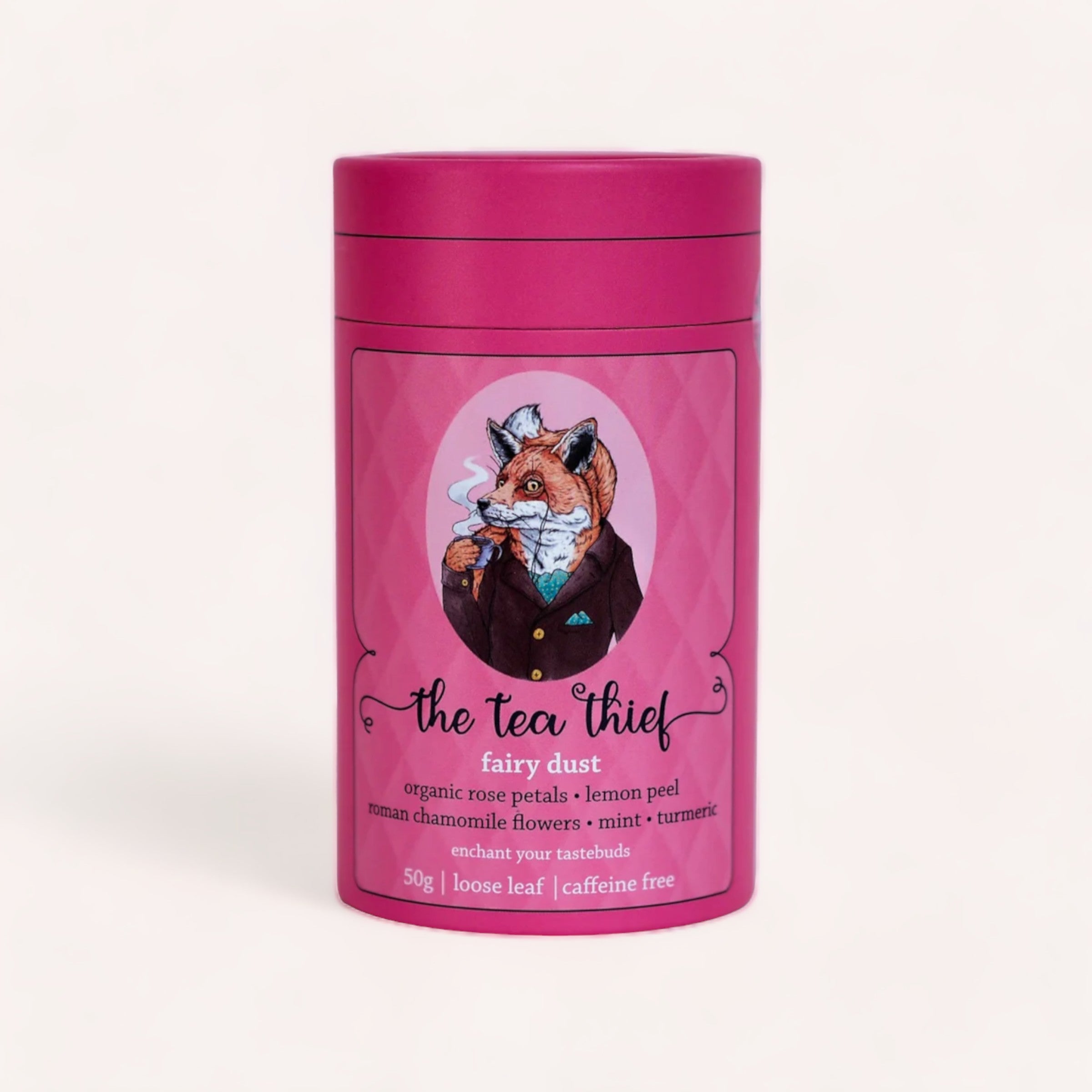 A whimsical tea tin featuring an illustration of a fox dressed in a suit, titled "Fairy Dust 50g by The Tea Thief," advertising a blend of organic rose petals, lemon peel, chamomile flowers, mint.