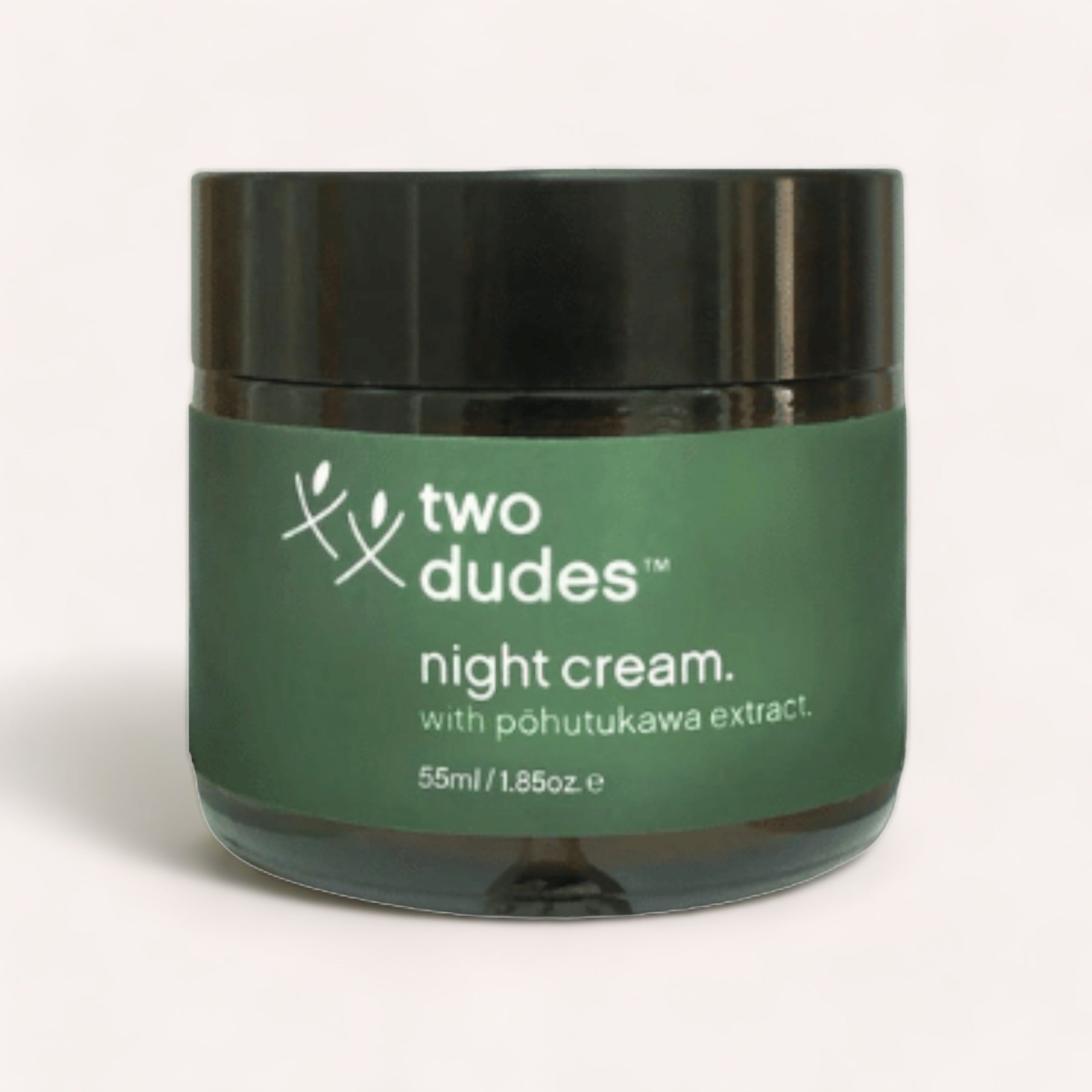 A small container with a green label for Night Cream by Two Dudes, an anti-aging cream.