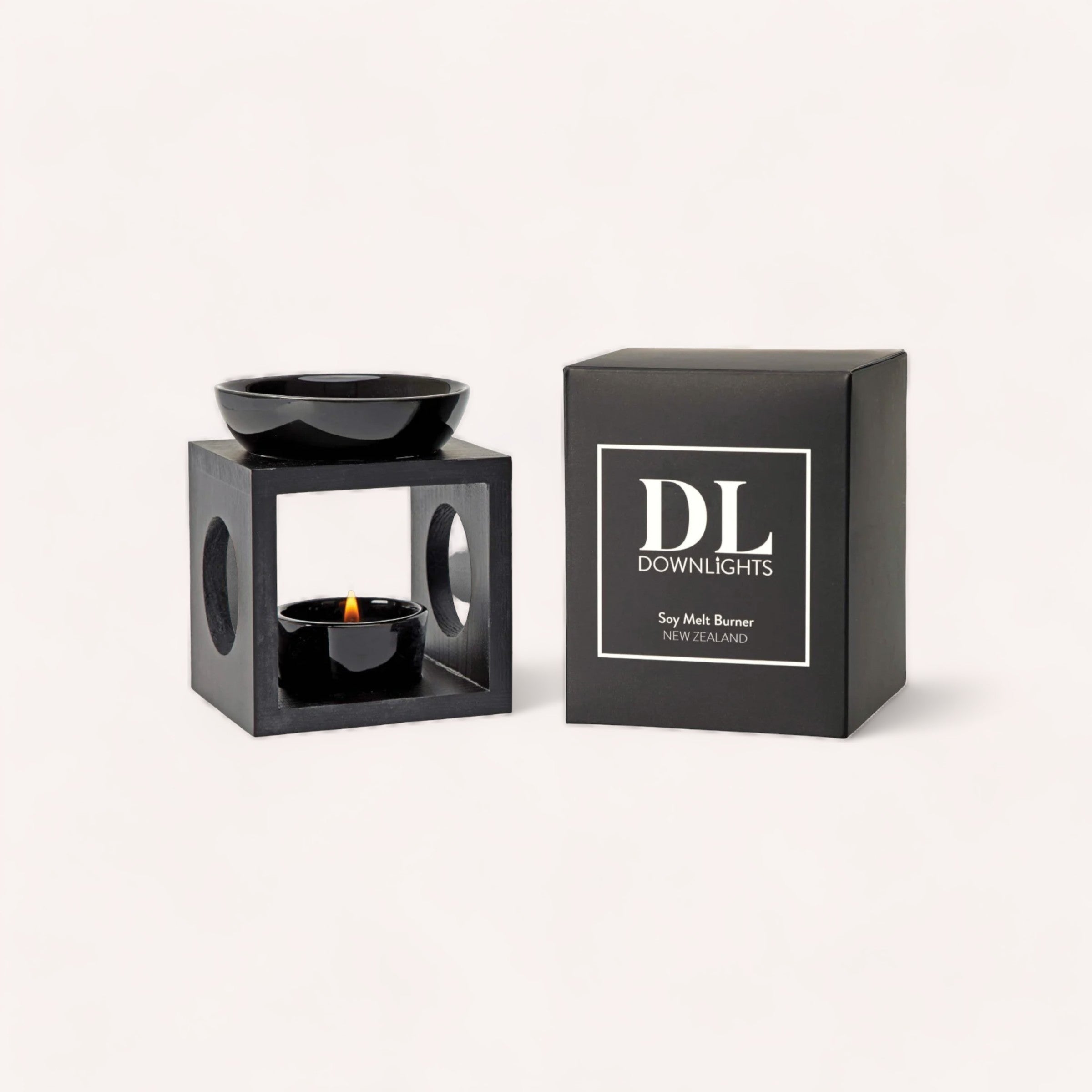 A sleek black Downlights Soy Melt Burner paired with its elegant packaging box on a neutral background.