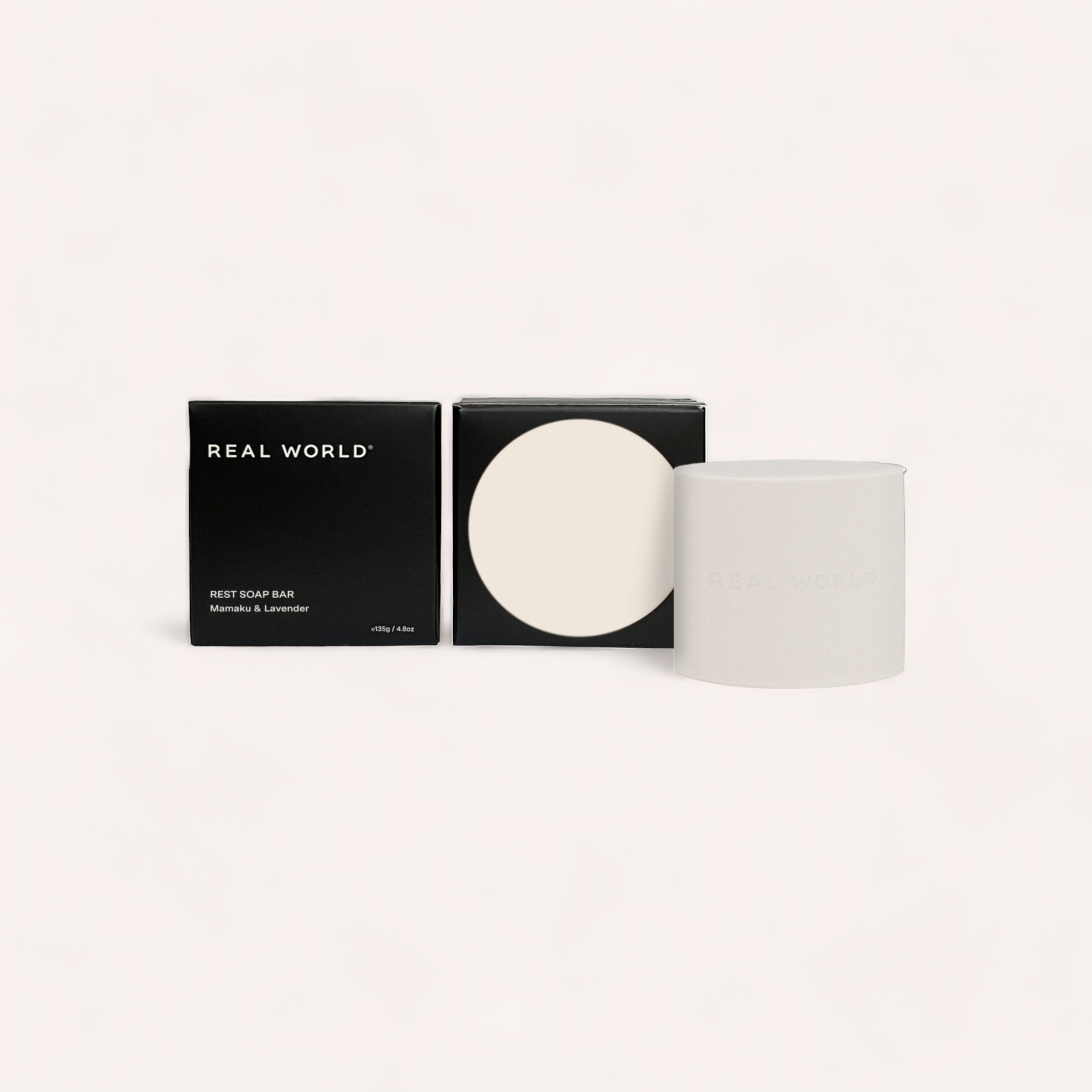 Sleek and modern packaging design for the "Soap Bar - Mamaku & Lavender" by Real World featuring a black and white color palette with clean typography, accented by notes of mamaku from New Zealand.