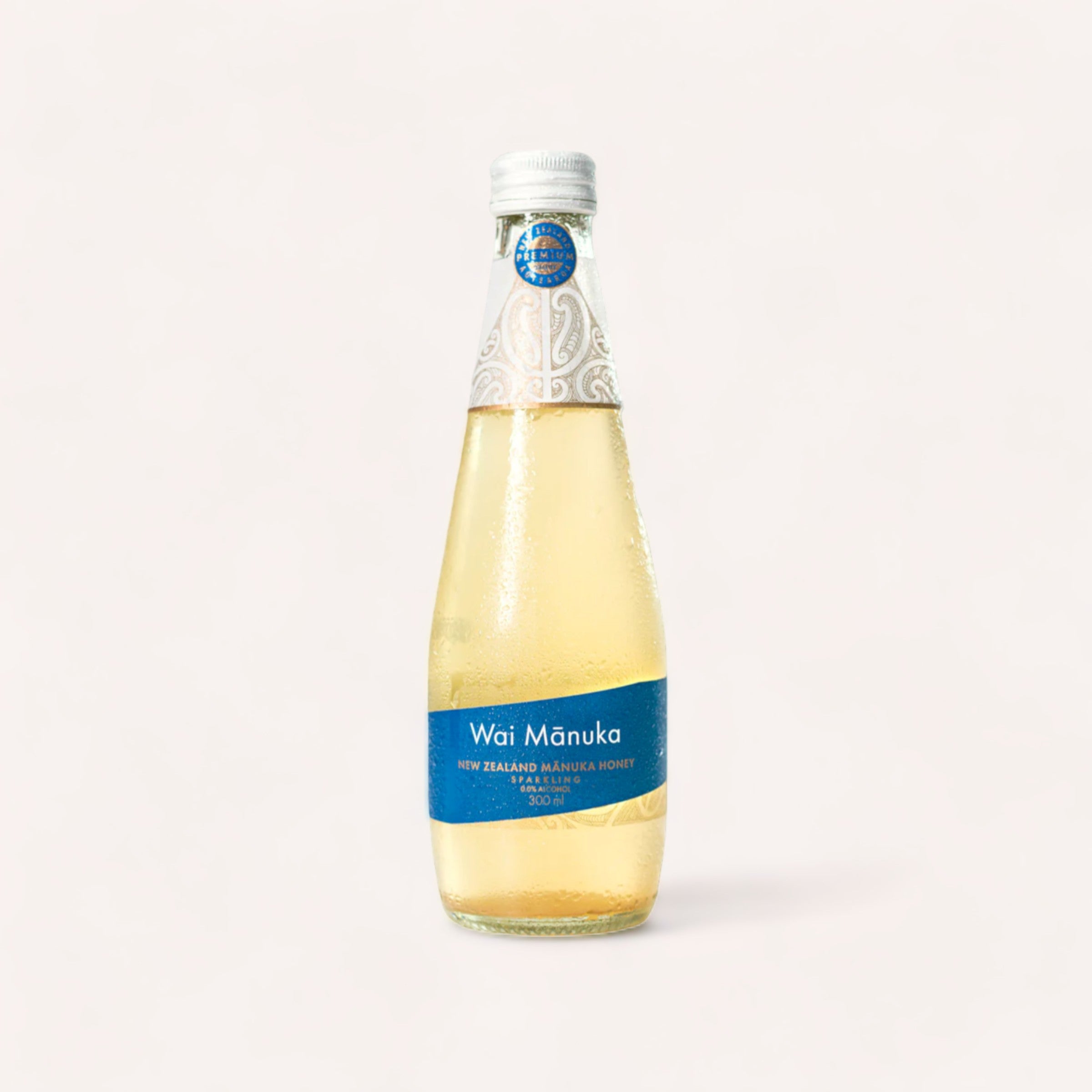 A bottle of Sparkling Honey & Lemon by Wai Manuka, promoting wellbeing against a clean, neutral background.