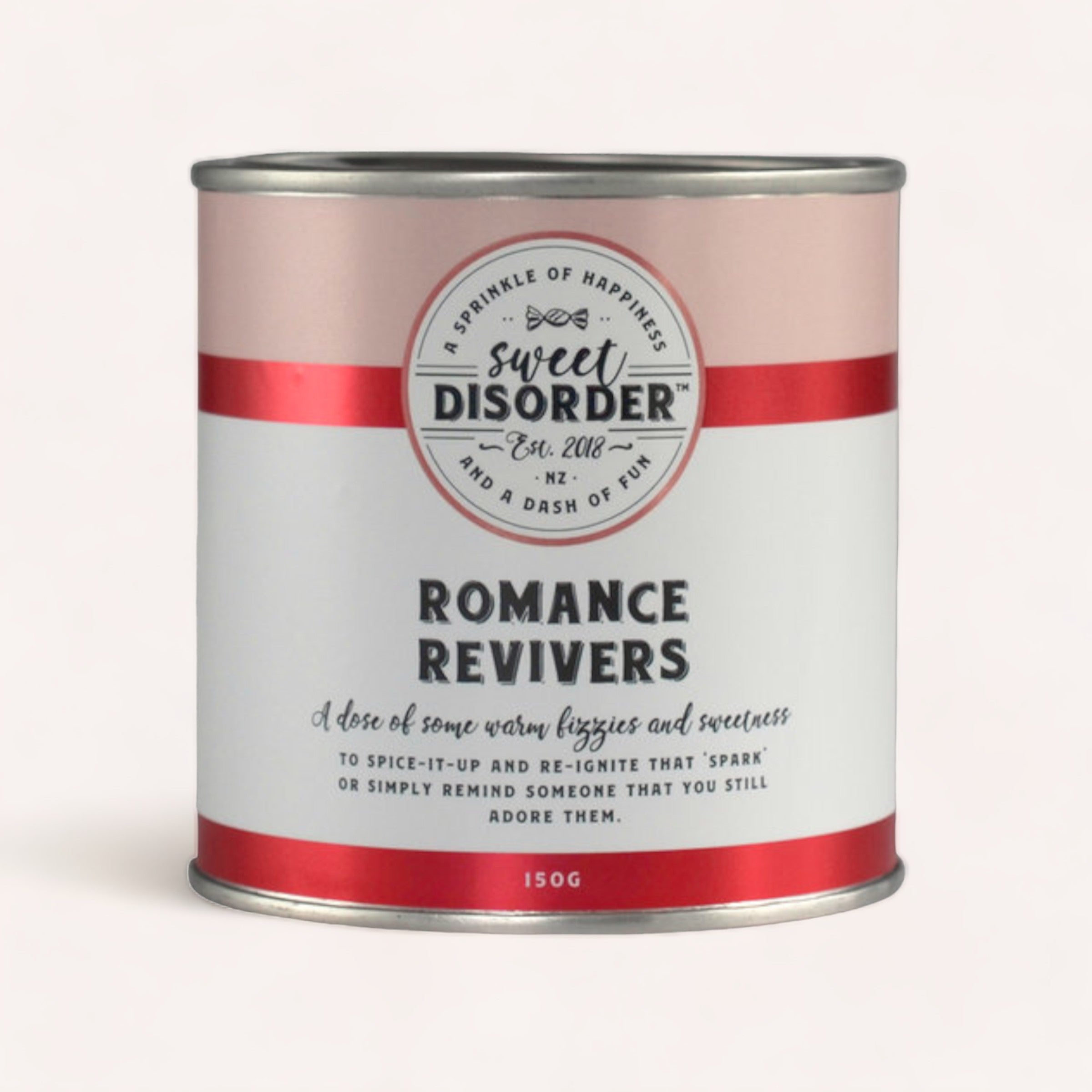 A whimsically labeled canister of Romance Revivers Lollies by Sweet Disorder from New Zealand, suggesting a playful remedy filled with sour peach heart candy to enhance happiness and reignite the spark in a relationship.