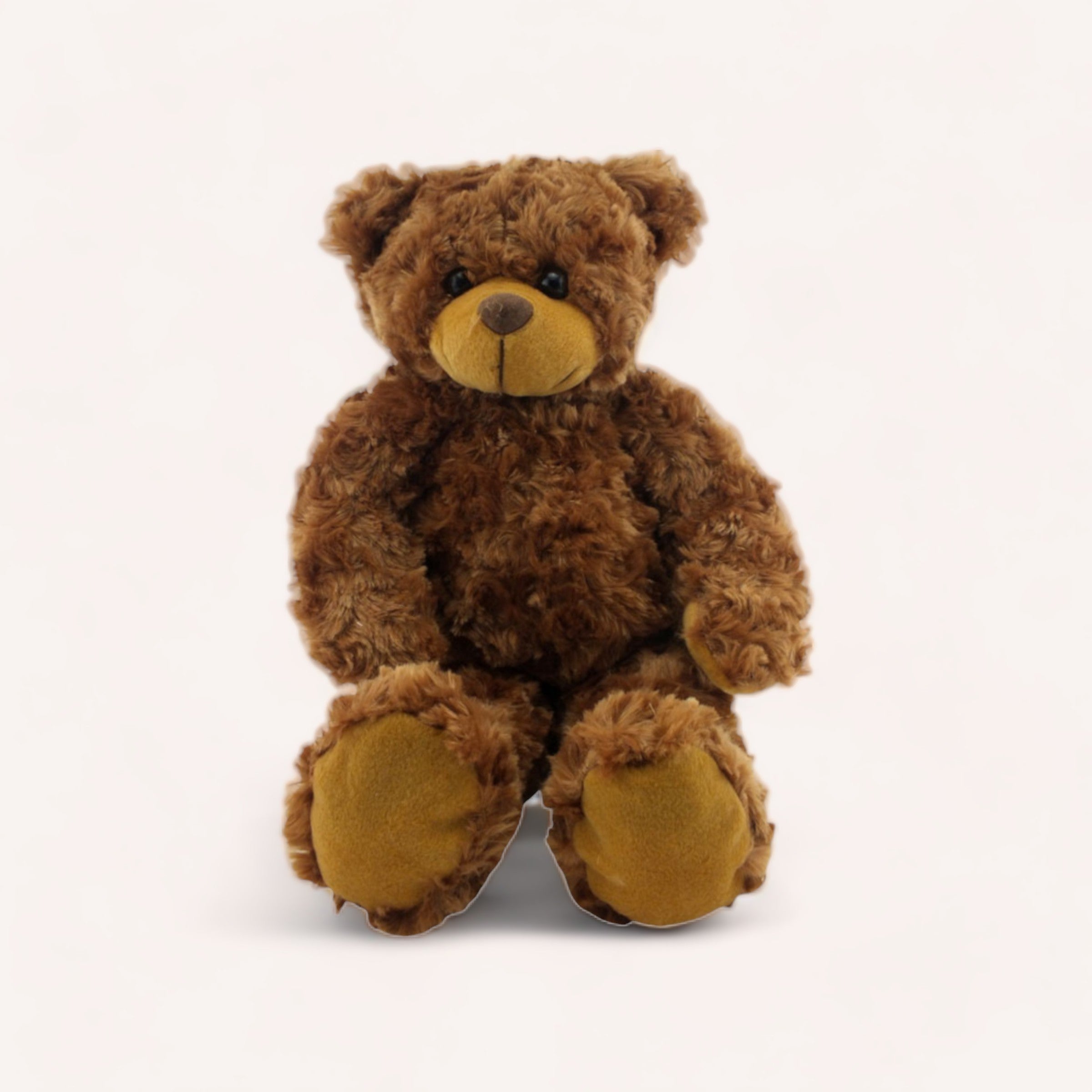 A cuddly charm, fluffy brown Harrison Bear sitting against a plain white background from The Teddy Factory.