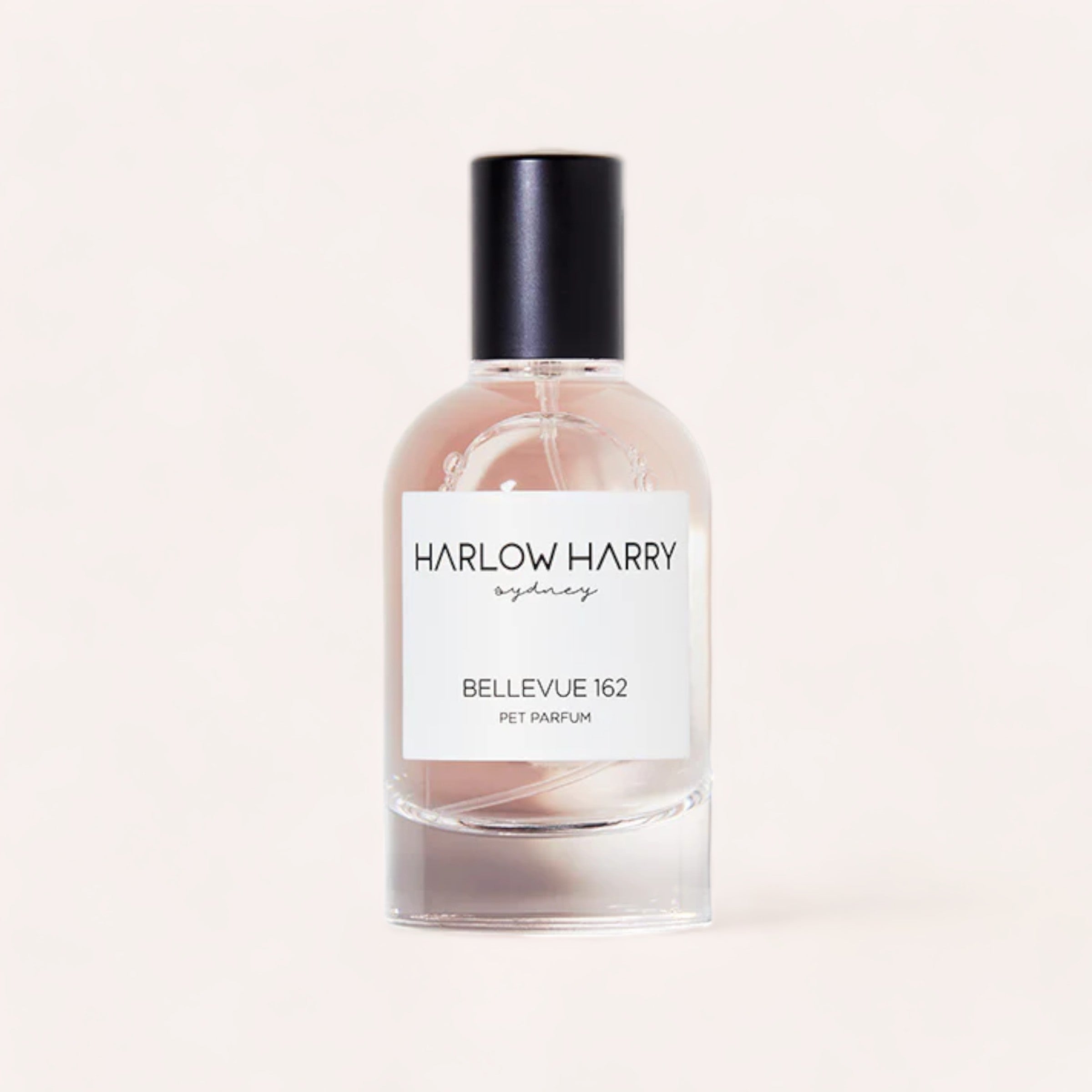 A sleek bottle of Harlow Harry dog perfume labeled "Bellevue 162" against a clean, light background.