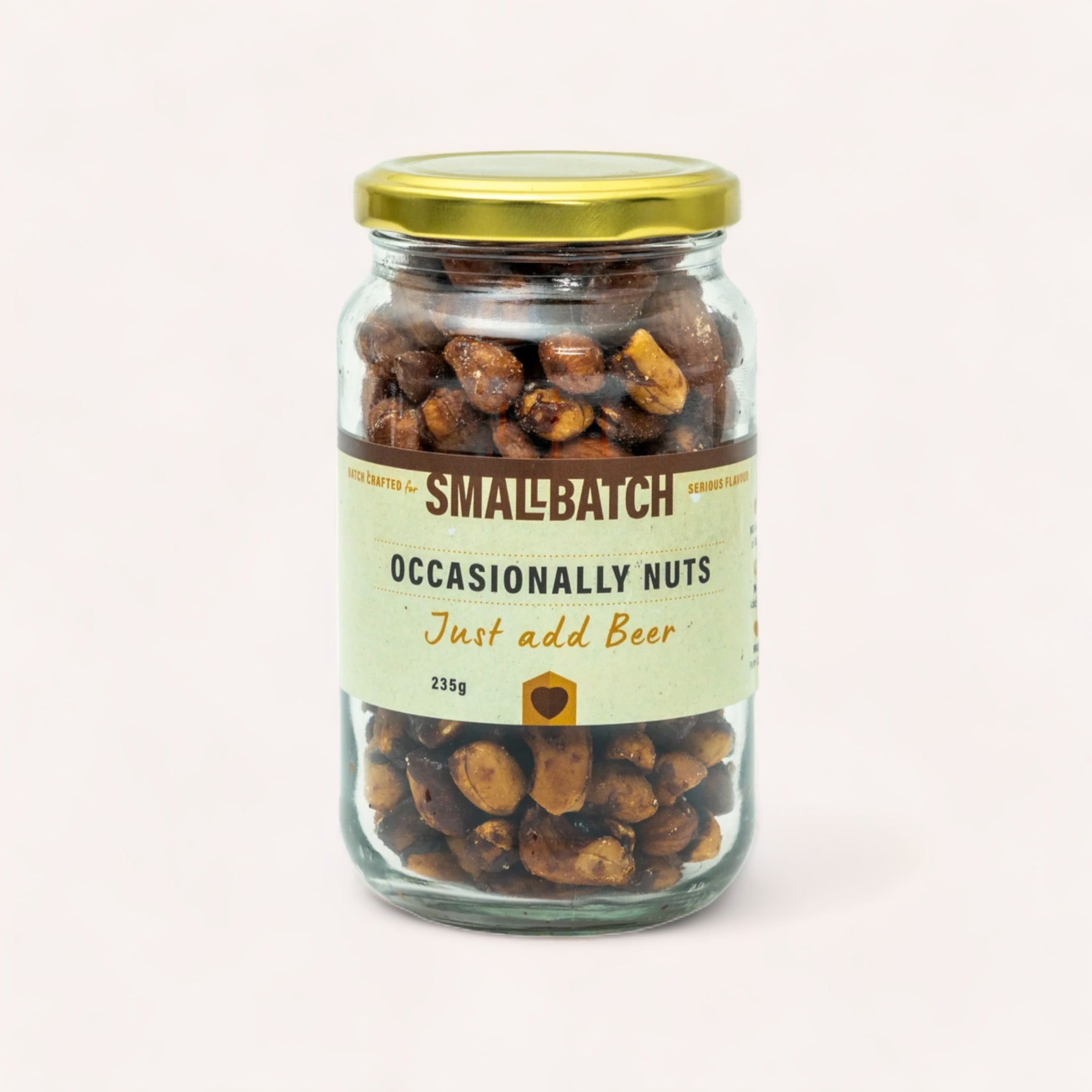 A glass jar filled with Mixed Nuts - Just add Beer by Smallbatch, labeled "Smallbatch - occasionally nuts, just add beer," against a plain white background.