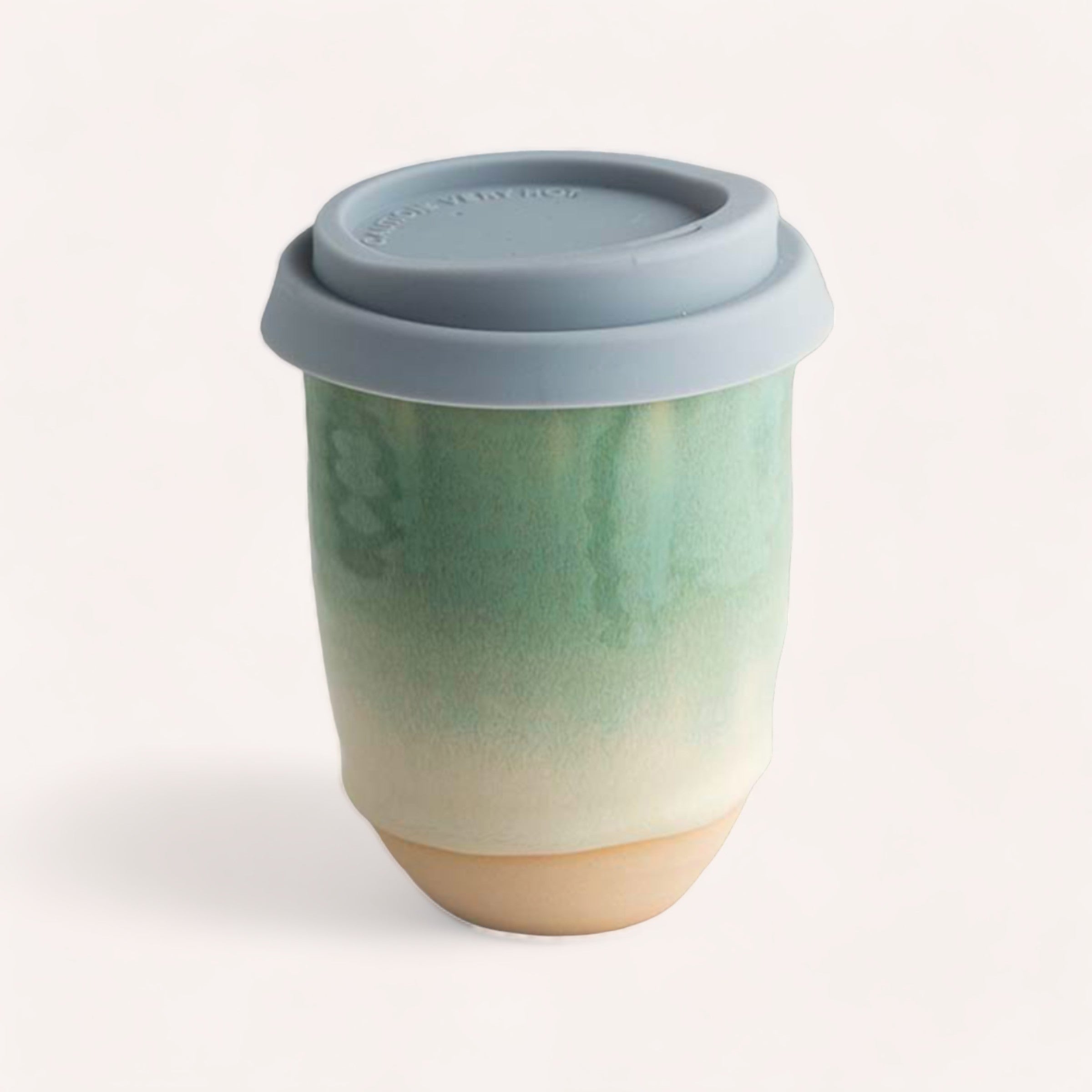 A handcrafted Ceramic Keep Cup by Sam Mayell with a watercolor design and a silicone lid.
