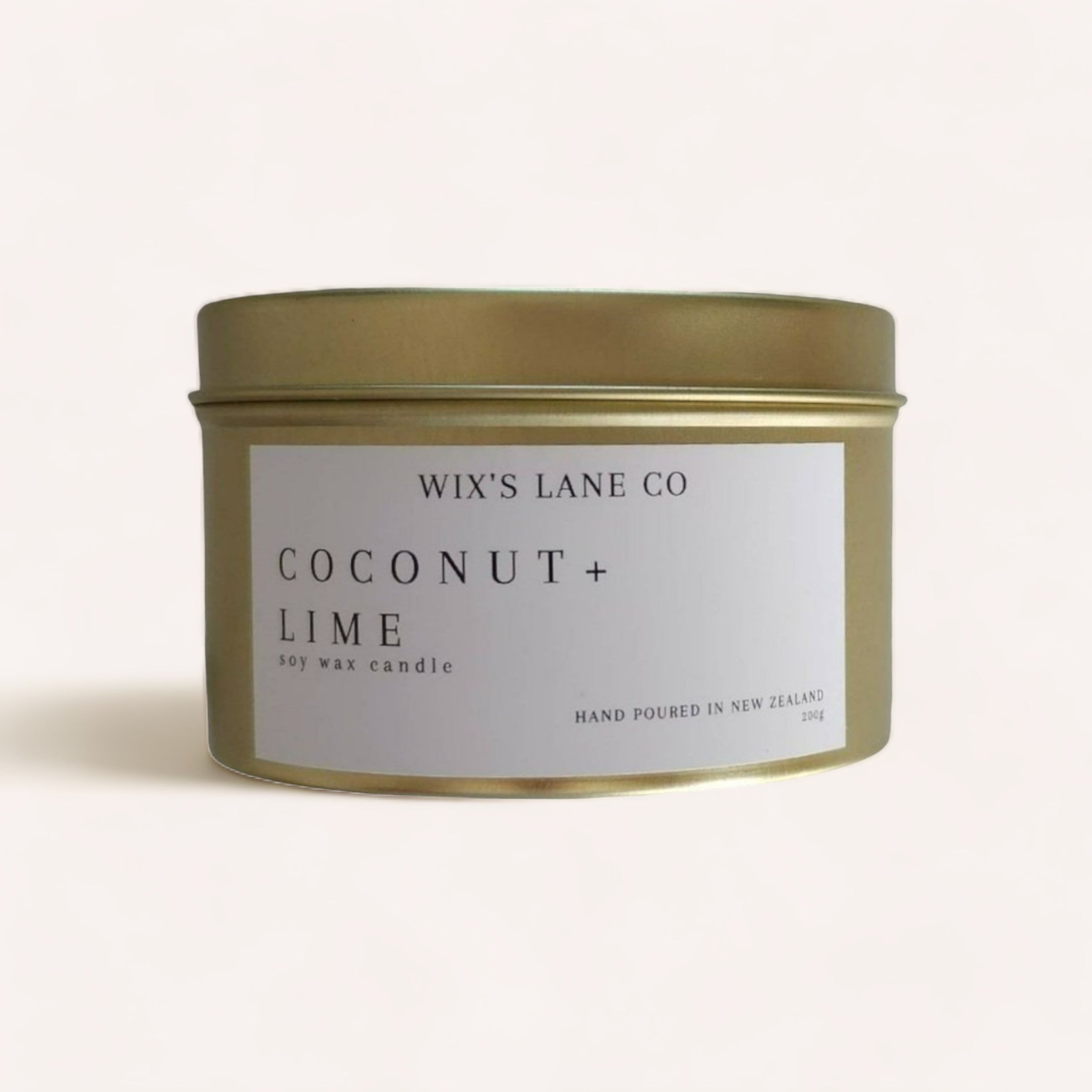 Simple and elegant Coconut + Lime Candle by Wix's Lane Co., hand-poured in New Zealand, presented in a sleek metal tin.