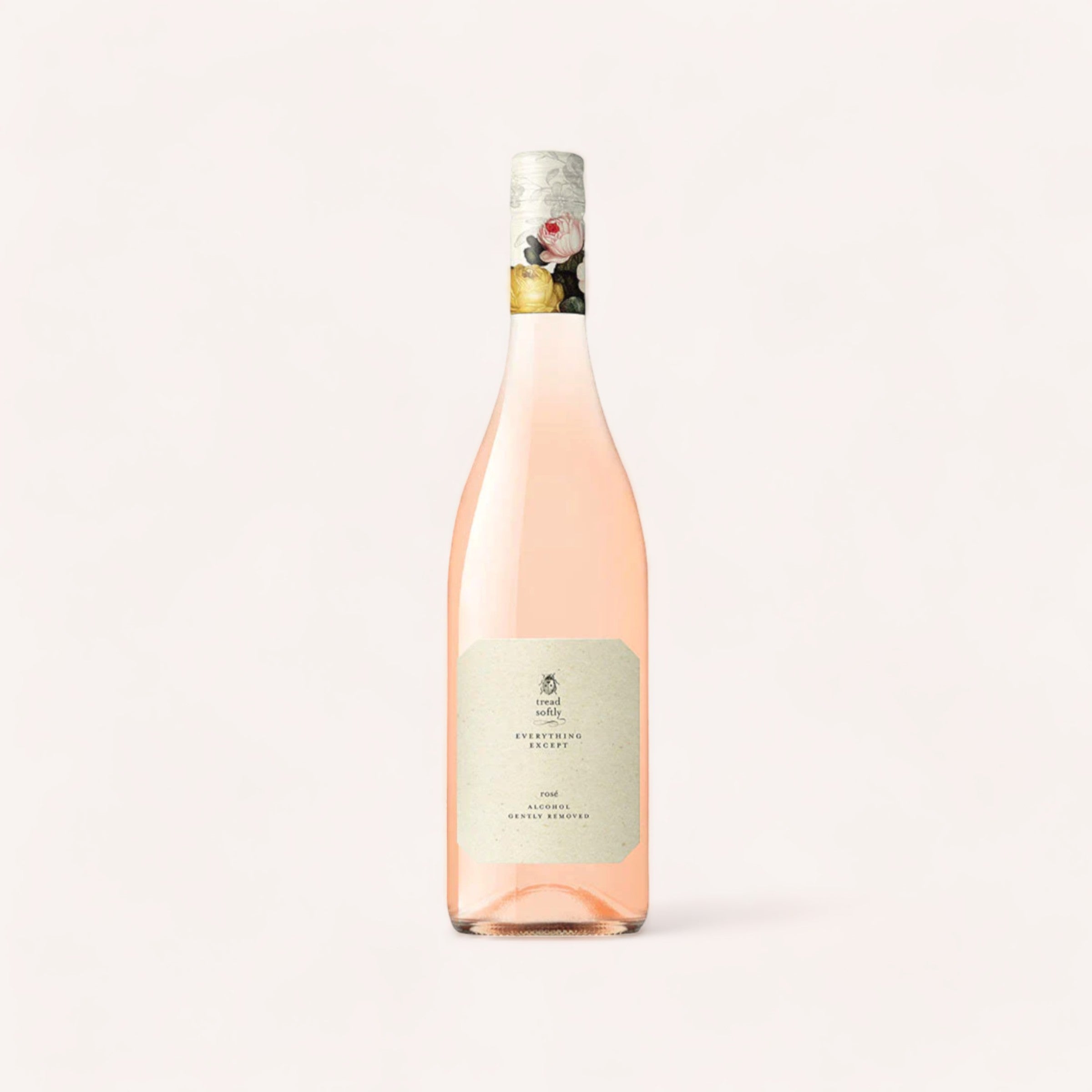 A bottle of Tread Softly non-alcoholic rosé wine with a label, sealed with foil, against a pale background.