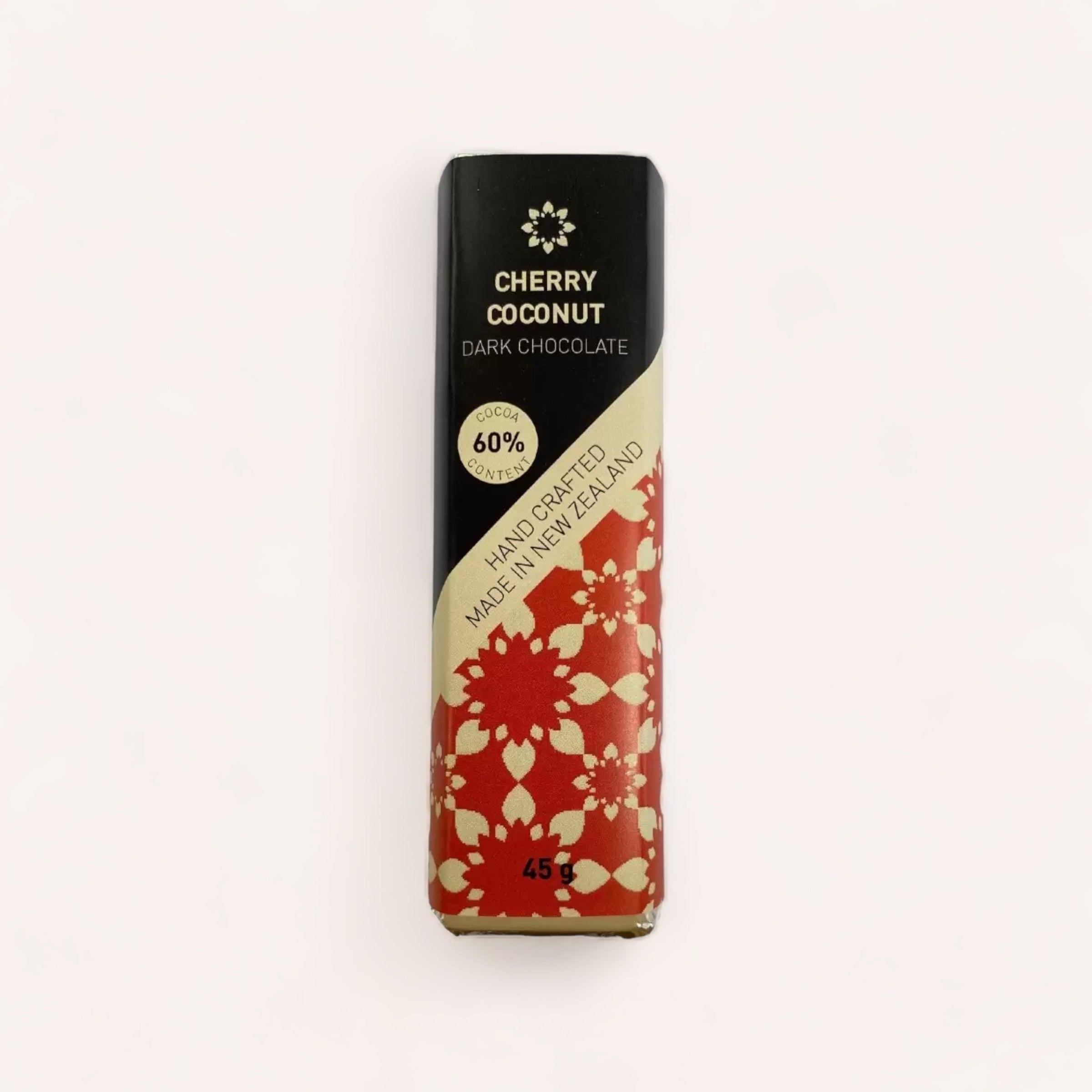 Artisanal Cherry Coconut Chocolate bar with 60% cocoa, handcrafted in New Zealand and vegan, 45g - elegantly packaged with floral design by Chocolate Traders.
