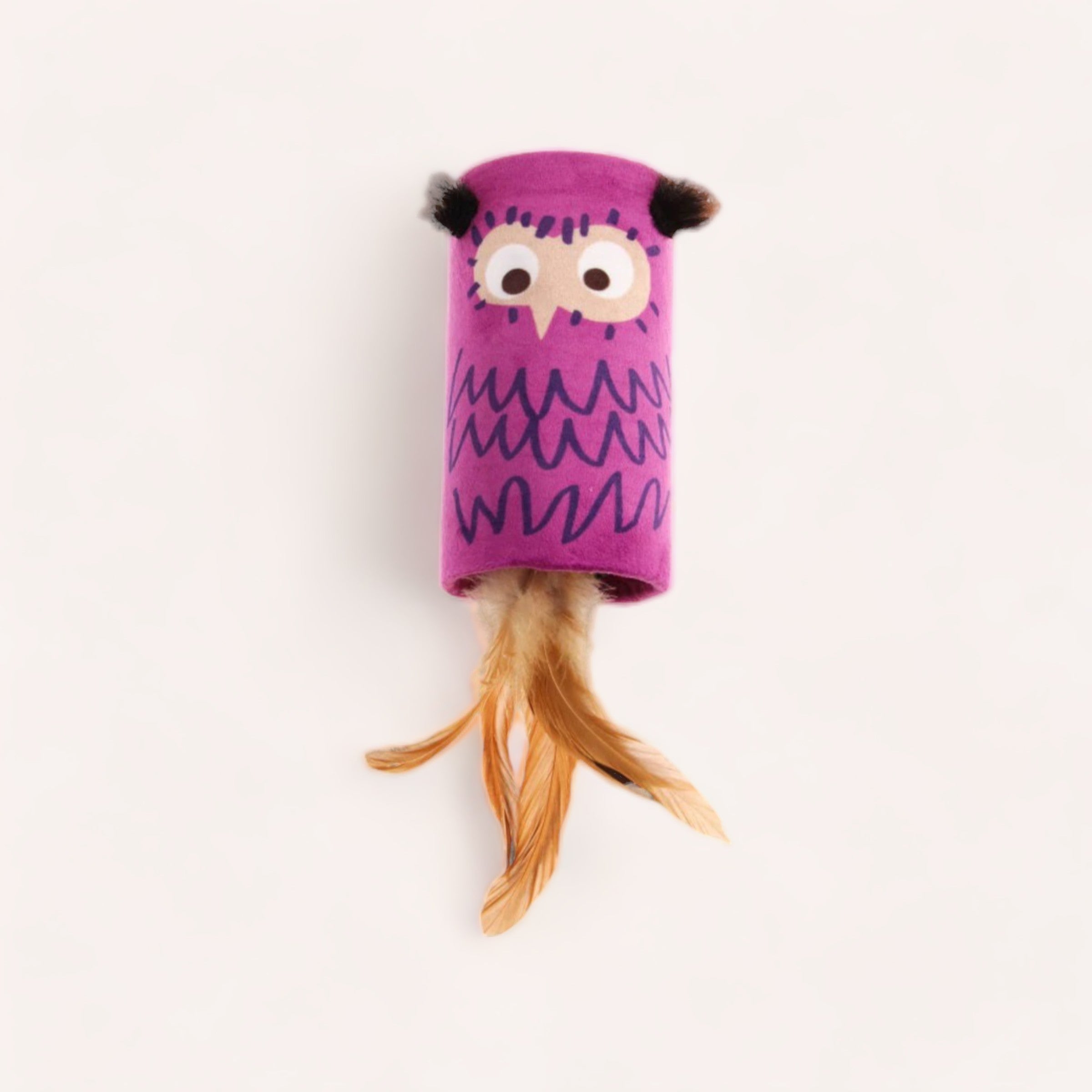 A colorful Owl Pet Toy by GiGwi with an owl-like face and a feathery tail, featuring a motion-activated sound chip, on a plain background by Wolves of Wellington.