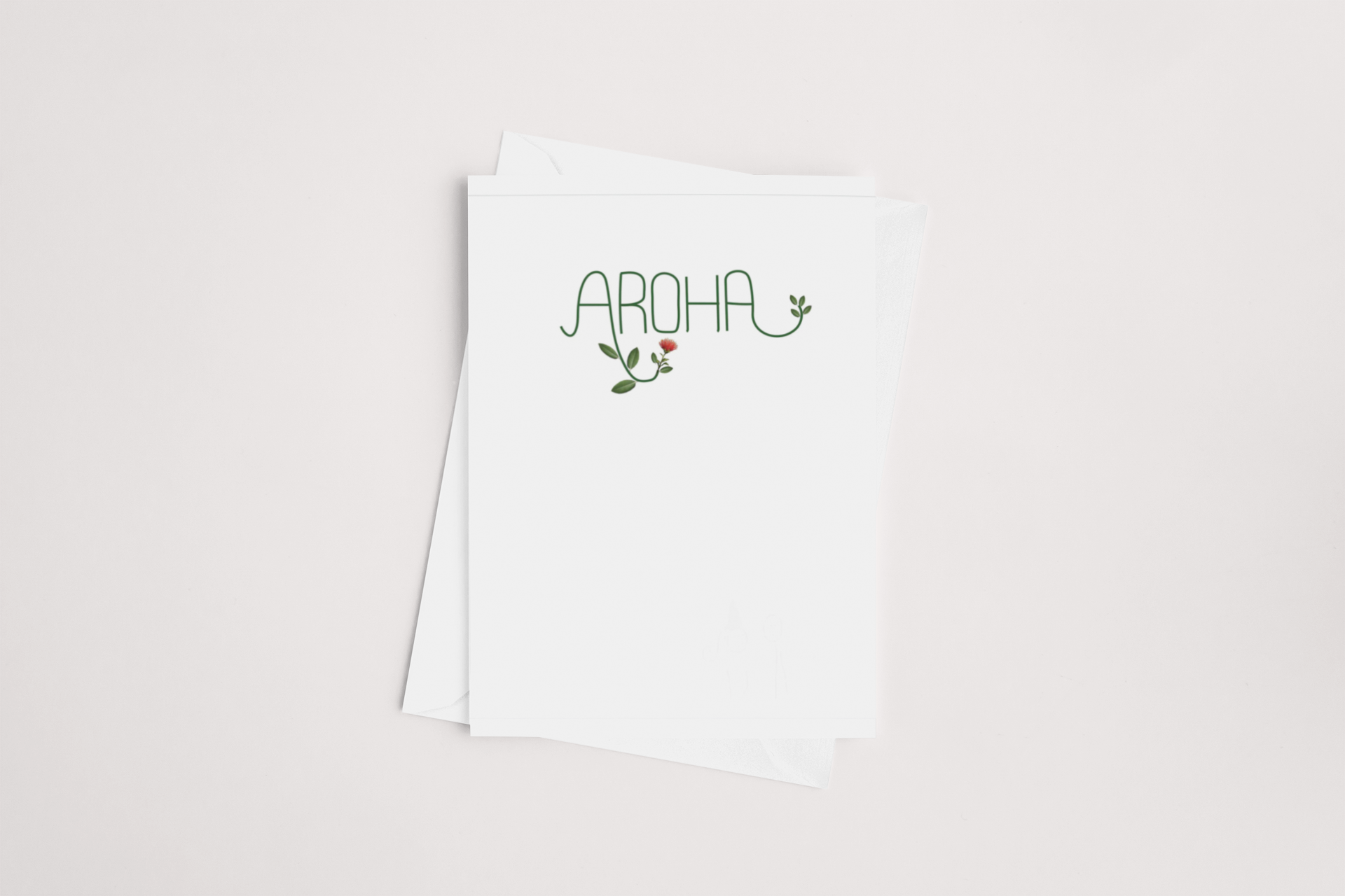 A Aroha Card, product of New Zealand, with the word "aroha" (which means "love" in Māori) written on it, featuring small green decorative elements that resemble plant.
