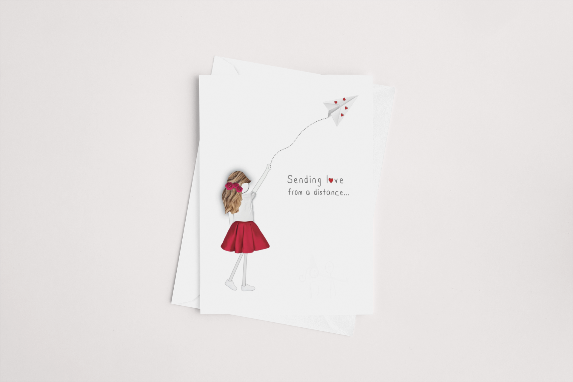 A heartfelt icandy Thinking of You Card with a whimsical illustration of a girl sending a paper plane, carrying the touching message "sending love from a distance..." on a clean white background.