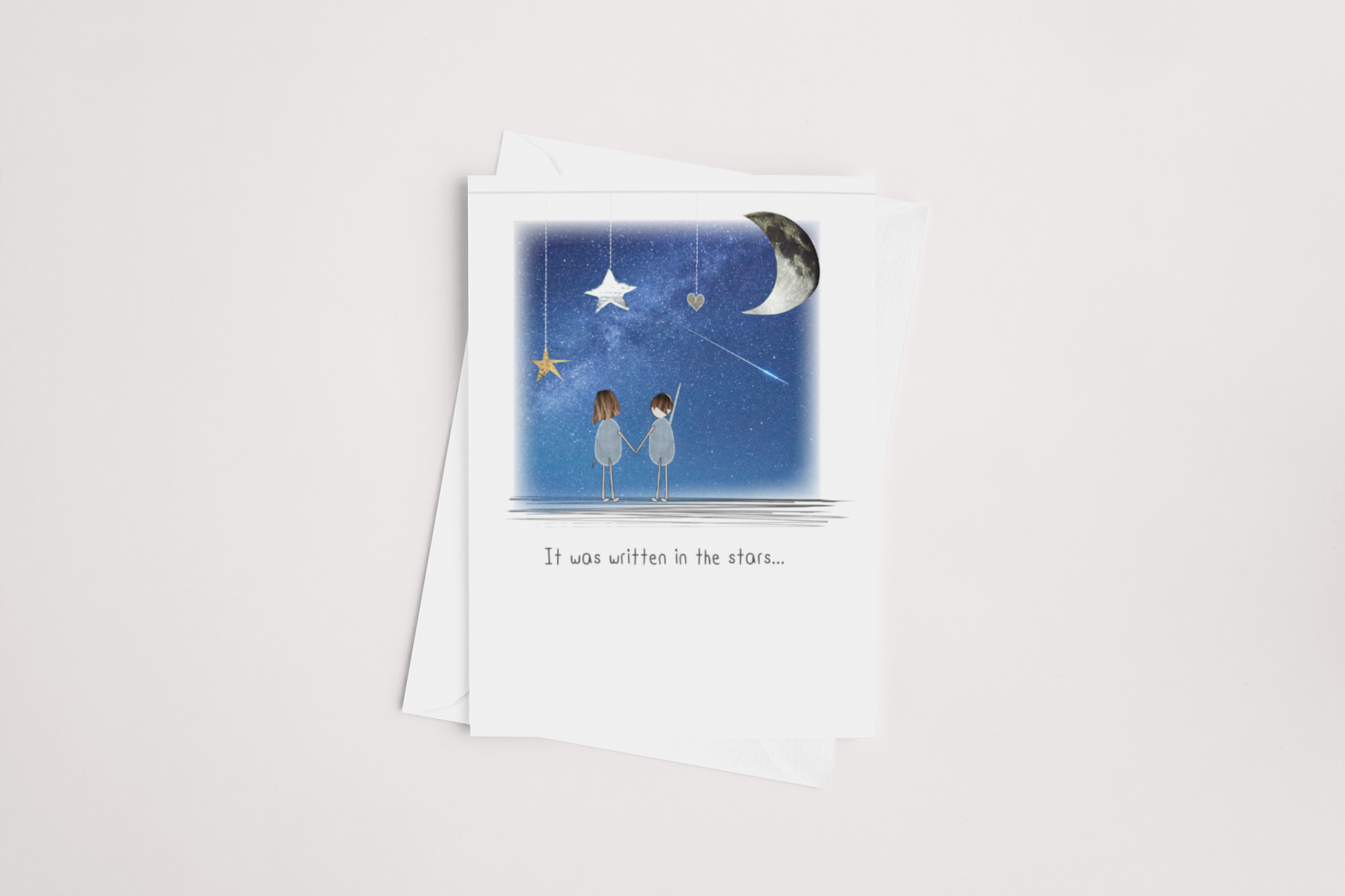 A beautifully illustrated multibuy It was written in the Stars Card with an enchanting nighttime scene, showcasing two characters under a starry sky, accompanied by the romantic phrase 'it was written in the stars...'. Brand: icandy.