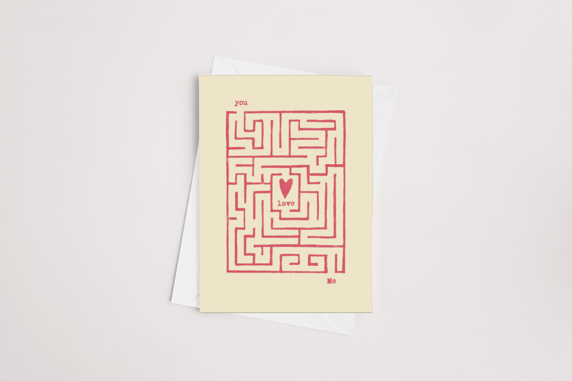 A Found Love Card, Product of New Zealand by Tuesday Print, with a heart-shaped maze design, where "you" and "me" lead to the word "love" at the center, symbolizing a journey to