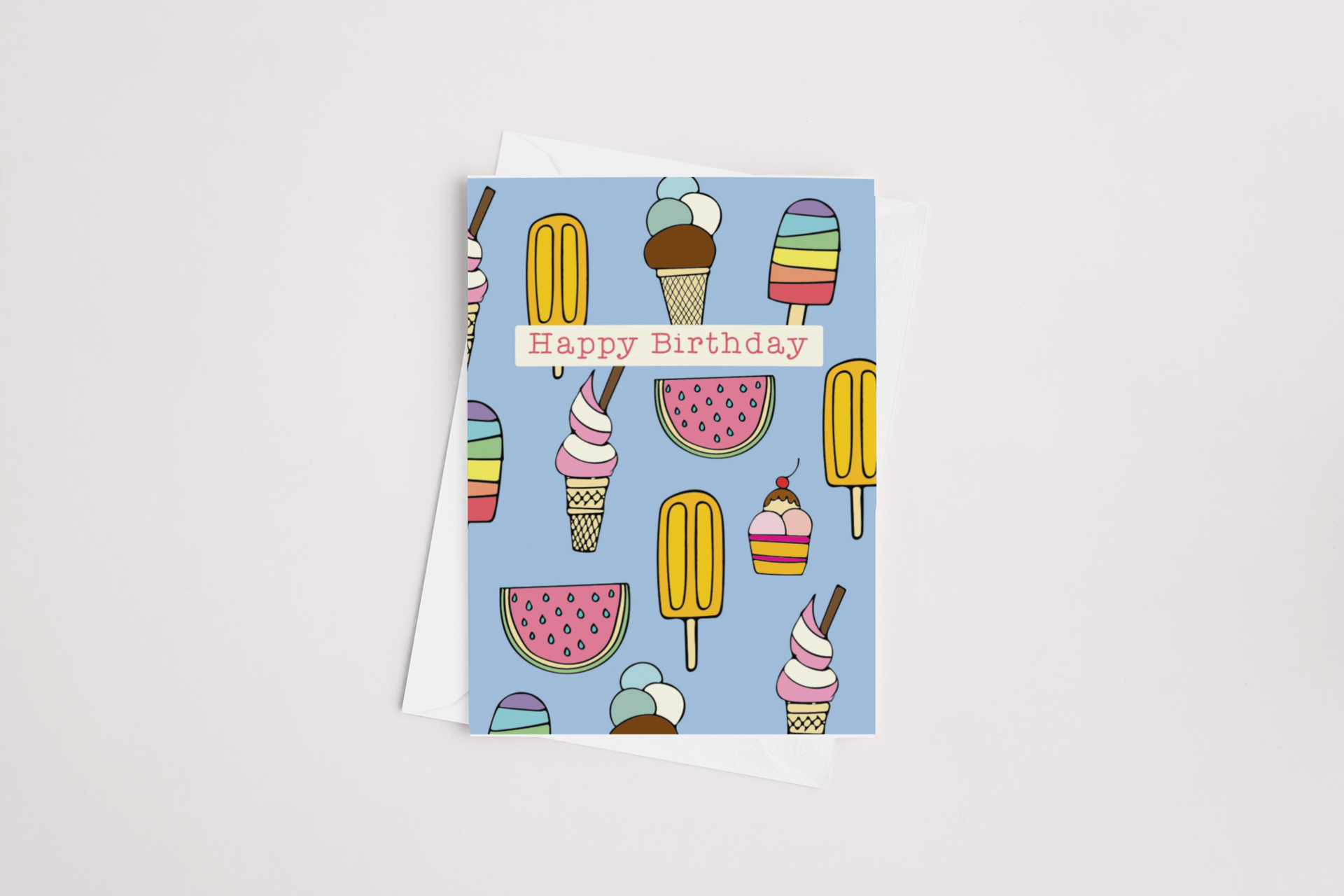 A Tuesday Print Ice Cream Birthday Card with a colorful illustration of assorted ice creams and popsicles, featuring the message "happy birthday" on a light blue background, blank inside.