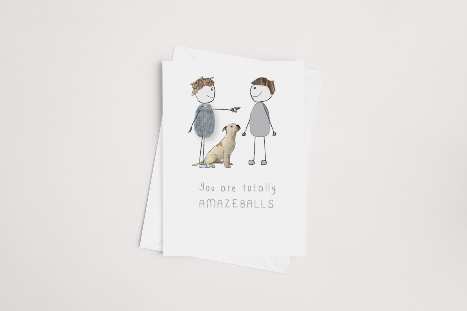 A You are totally Amazeballs Card featuring an illustration of two cartoon children giving each other a high five with a dog beside them, accompanied by the quirky phrase, "you are totally amazeballs," now available for icandy.