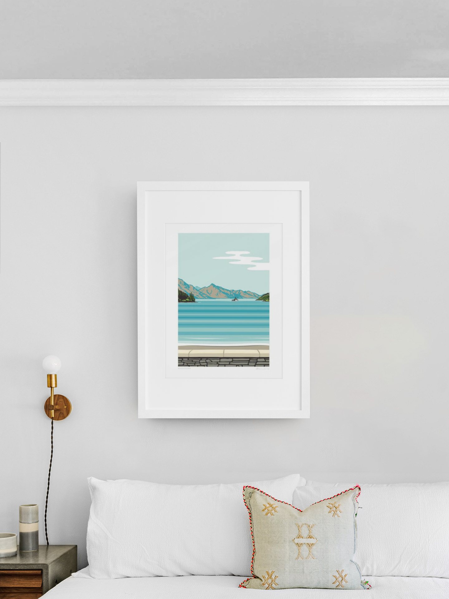 A tranquil landscape painting from Glenn Jones' Queenstown Series, featuring a serene Lake Earnslaw and mountains near Queenstown, hangs elegantly on a clean, white wall, adding a touch of calm.