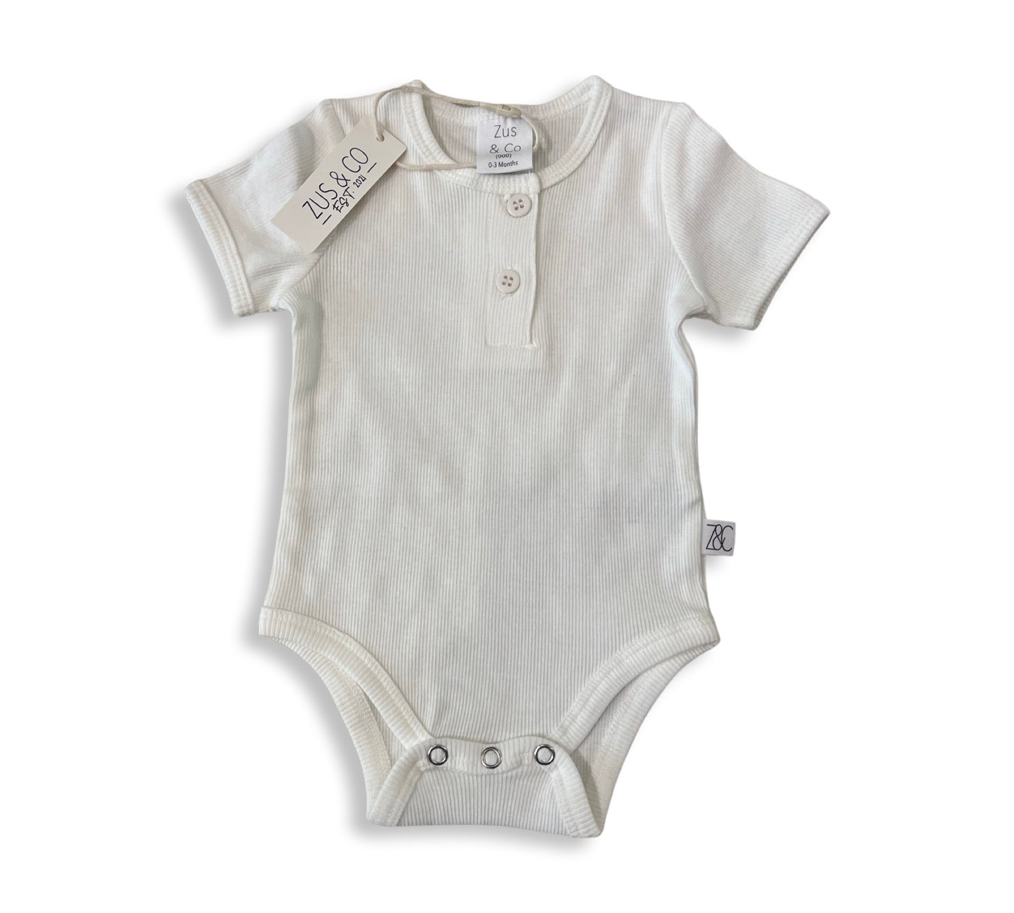 New Arrival baby bodysuit laid flat on a neutral background, accompanied by merino knit booties from giftbox co.