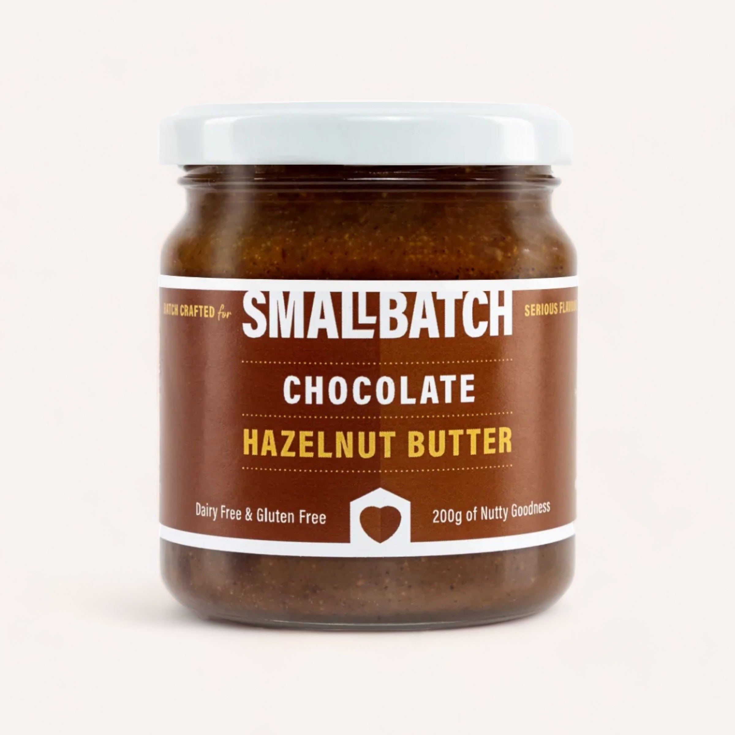 A jar of Smallbatch Spread the Love peanut butter, boasting "serious flavor," dairy and gluten-free qualities, with 200 grams of nutty goodness.