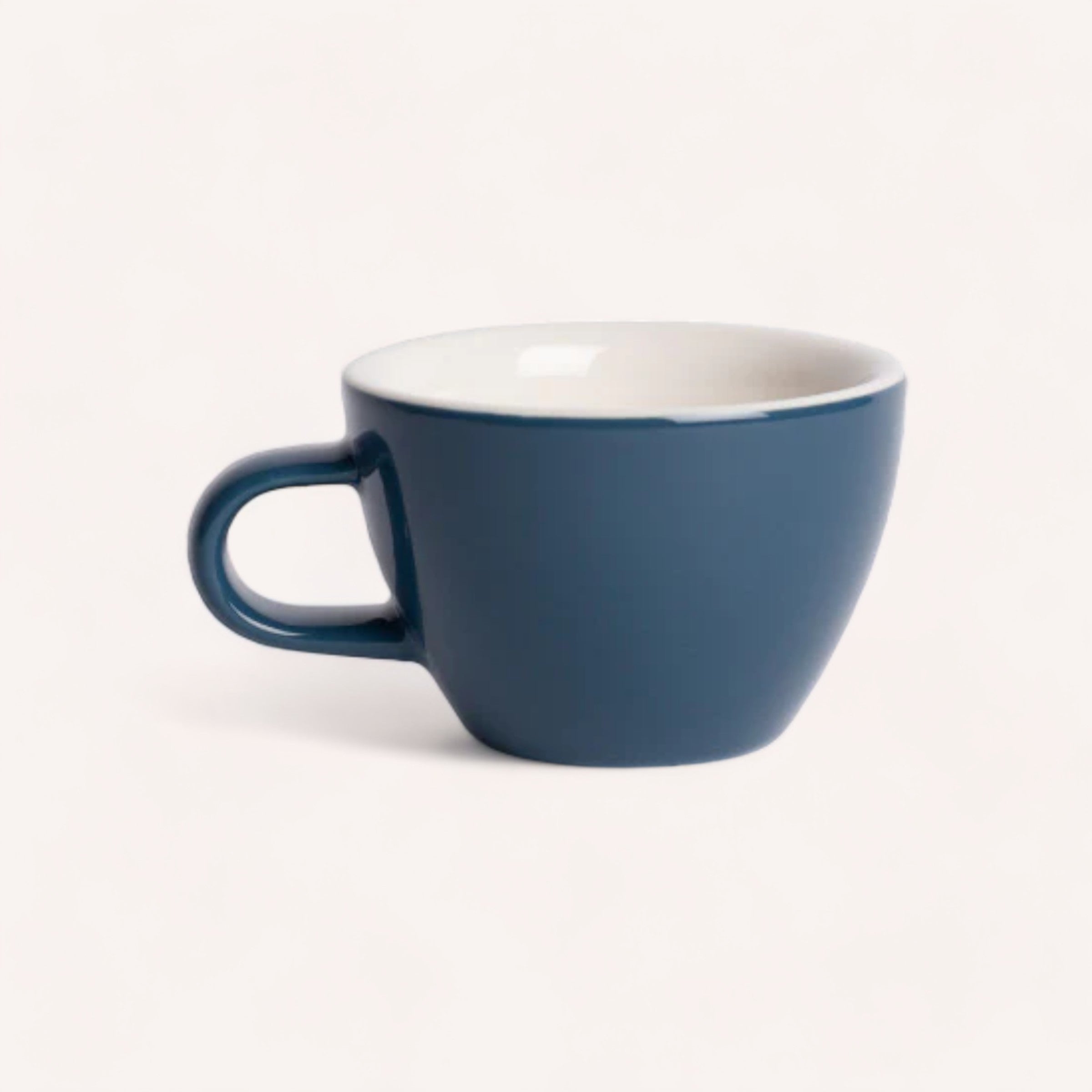 A simple blue giftbox co. Coffee, Anyone? ceramic mug against a white background.