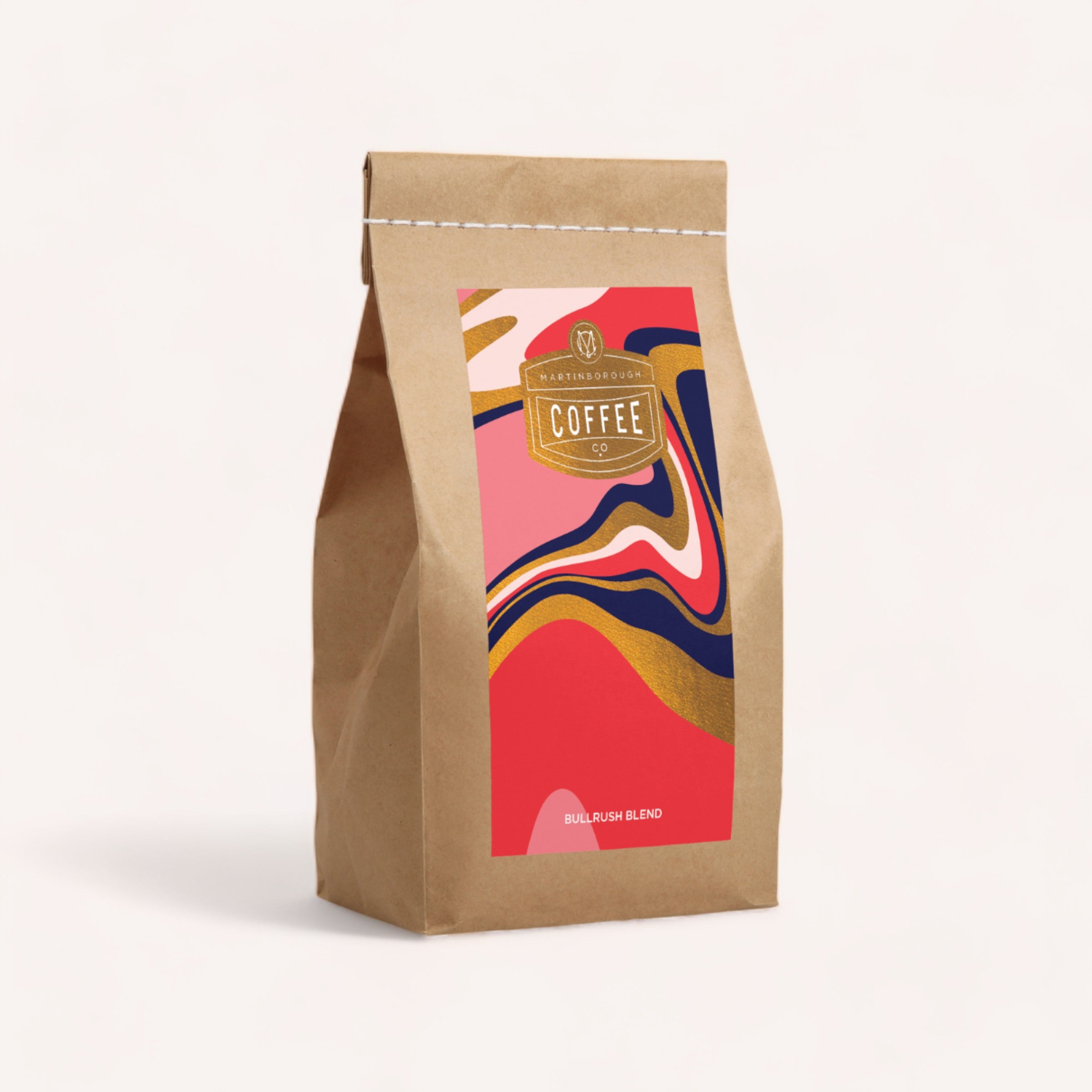 A stylishly branded package of giftbox co. Coffee, Anyone? with vibrant abstract design on a plain background.