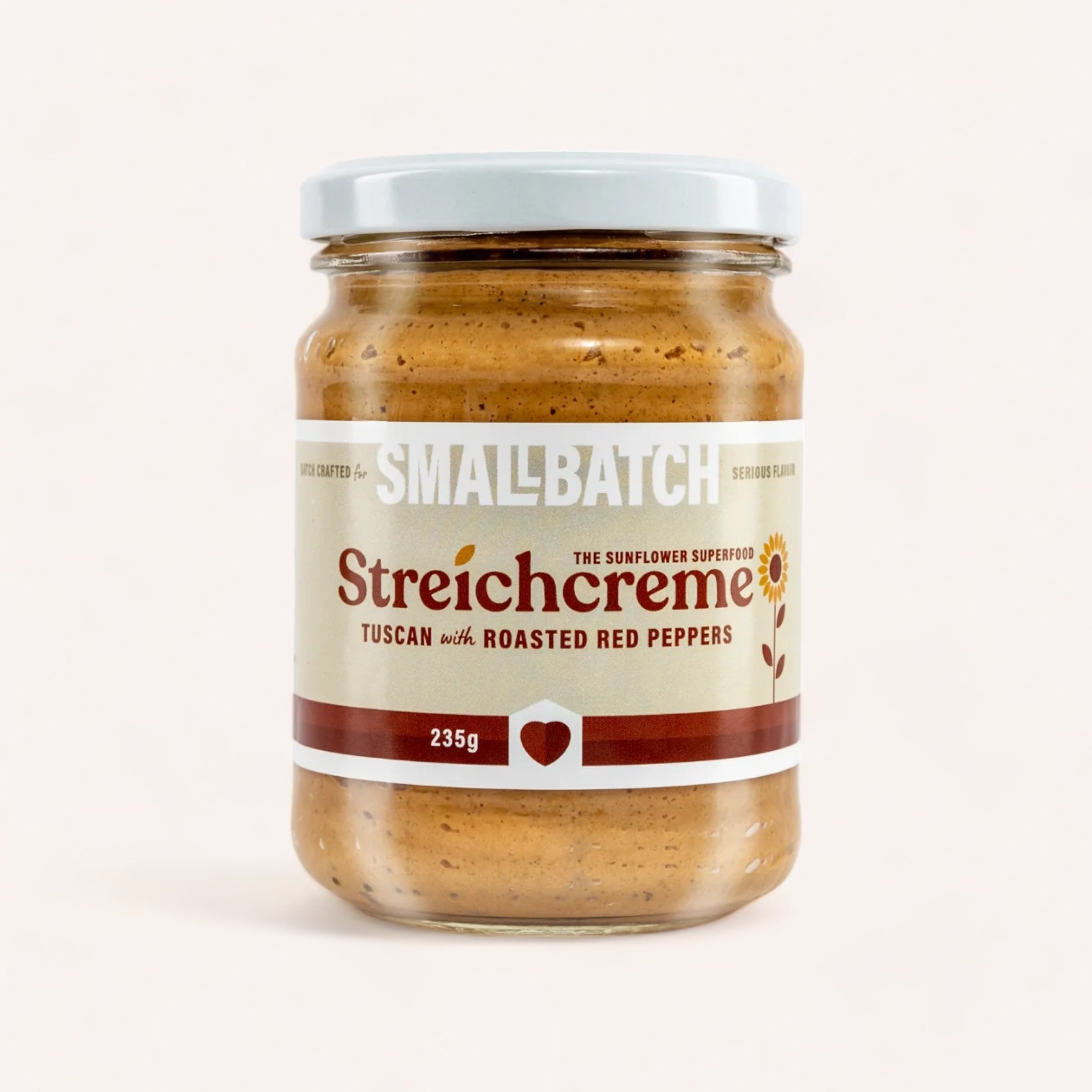 A jar of Smallbatch Tuscan Streichcreme, the sunflower seed-based dip with Tuscan flavor and roasted red peppers, weighing 235 grams.