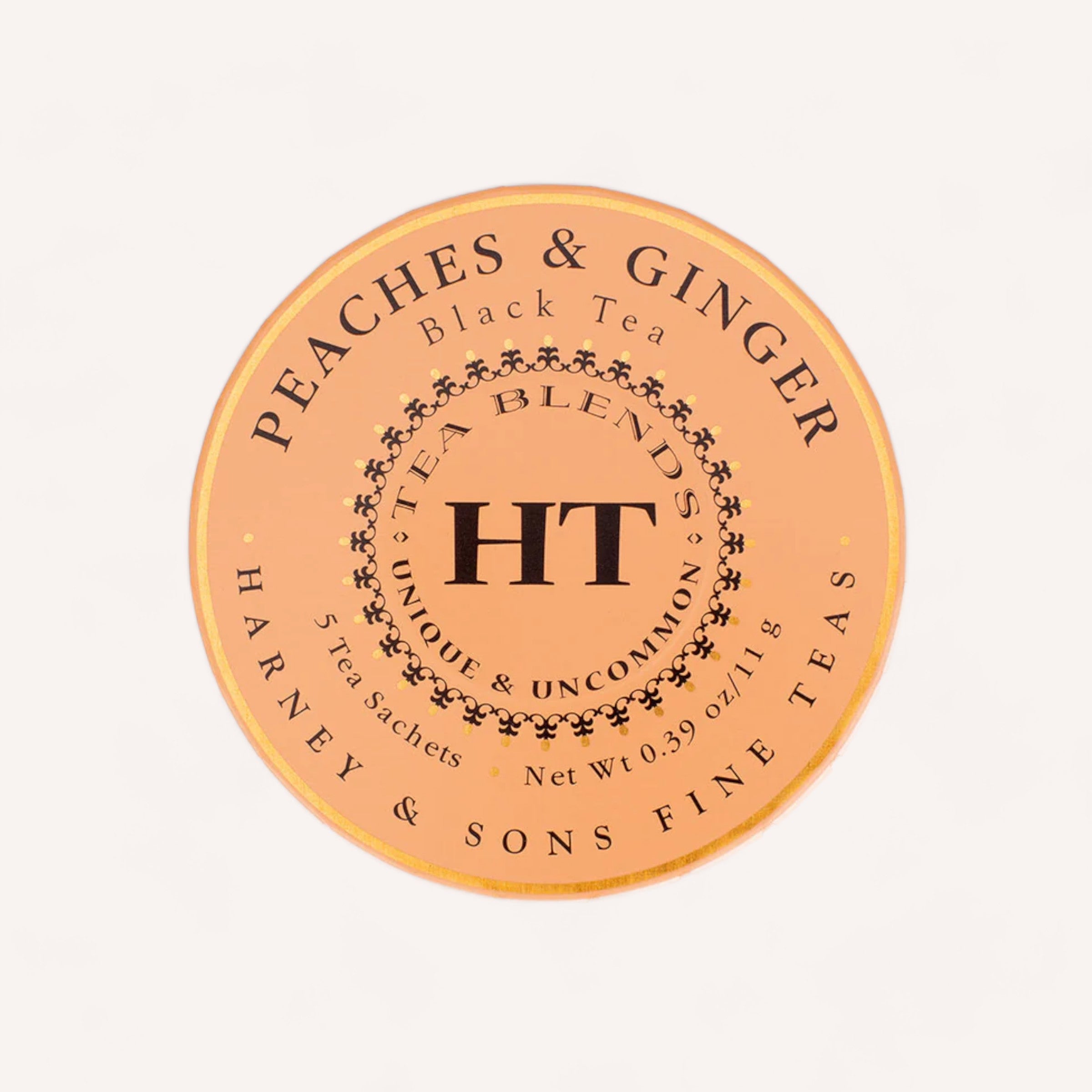 Round tin lid for the Harney & Sons Tea Travel Pack. Text displays: "Peaches & Ginger Black Tea," "Tea Blends," "Unique & Uncommon," "5 Pyramid Silken Sachets," and "Net Wt. 0.39 oz/11g." The orange background features decorative dots surrounding the classic "HT" logo in the center.