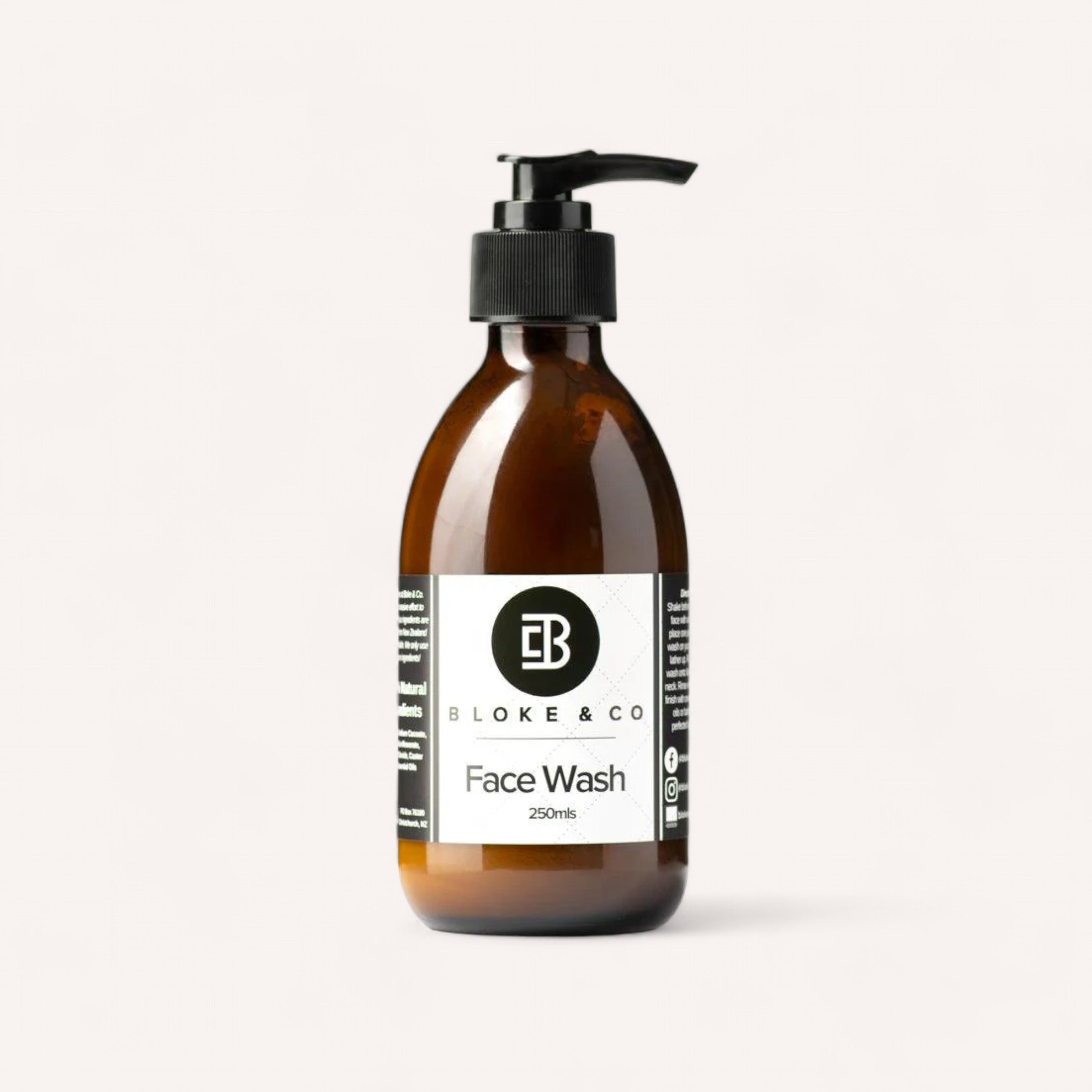 A brown pump bottle labeled "Face Wash by Bloke & Co" sits against a plain white background. The label features a black and white design, with the Bloke & Co logo and name at the top. This natural face wash, crafted in New Zealand, contains 250ml of product.