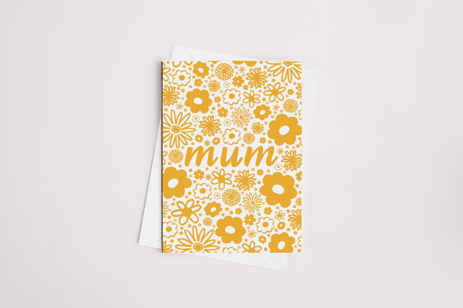 A Tuesday Print Retro Mum Mother's Day Card on a white background with a vibrant yellow floral design and the word "mum" in the center.