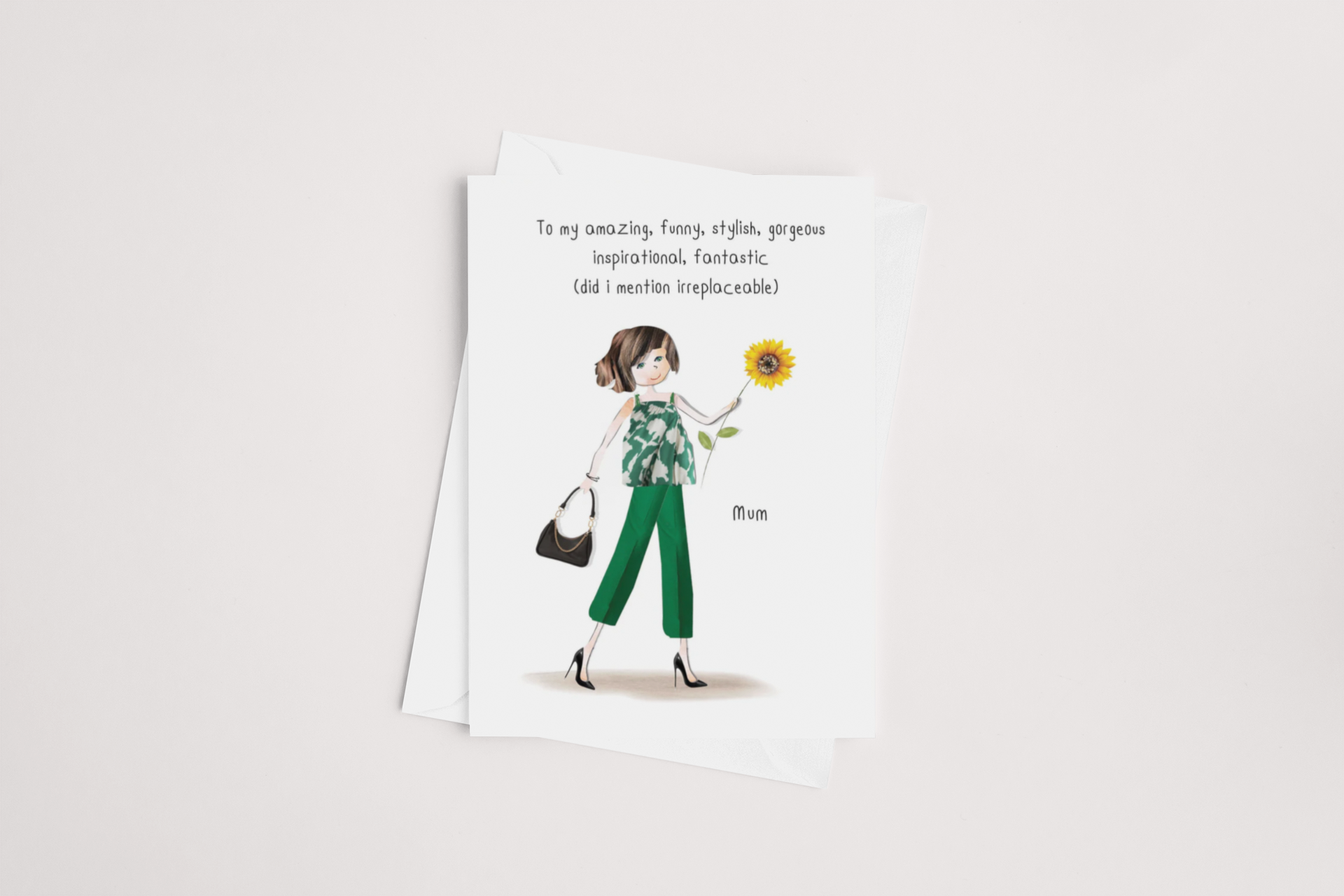 A Irreplaceable Mum Mother's Day Card from icandy on a plain background featuring an illustrated woman holding a sunflower and a handbag, with a text saying "to an amazing, funny, stylish, gorgeous, inspirational.